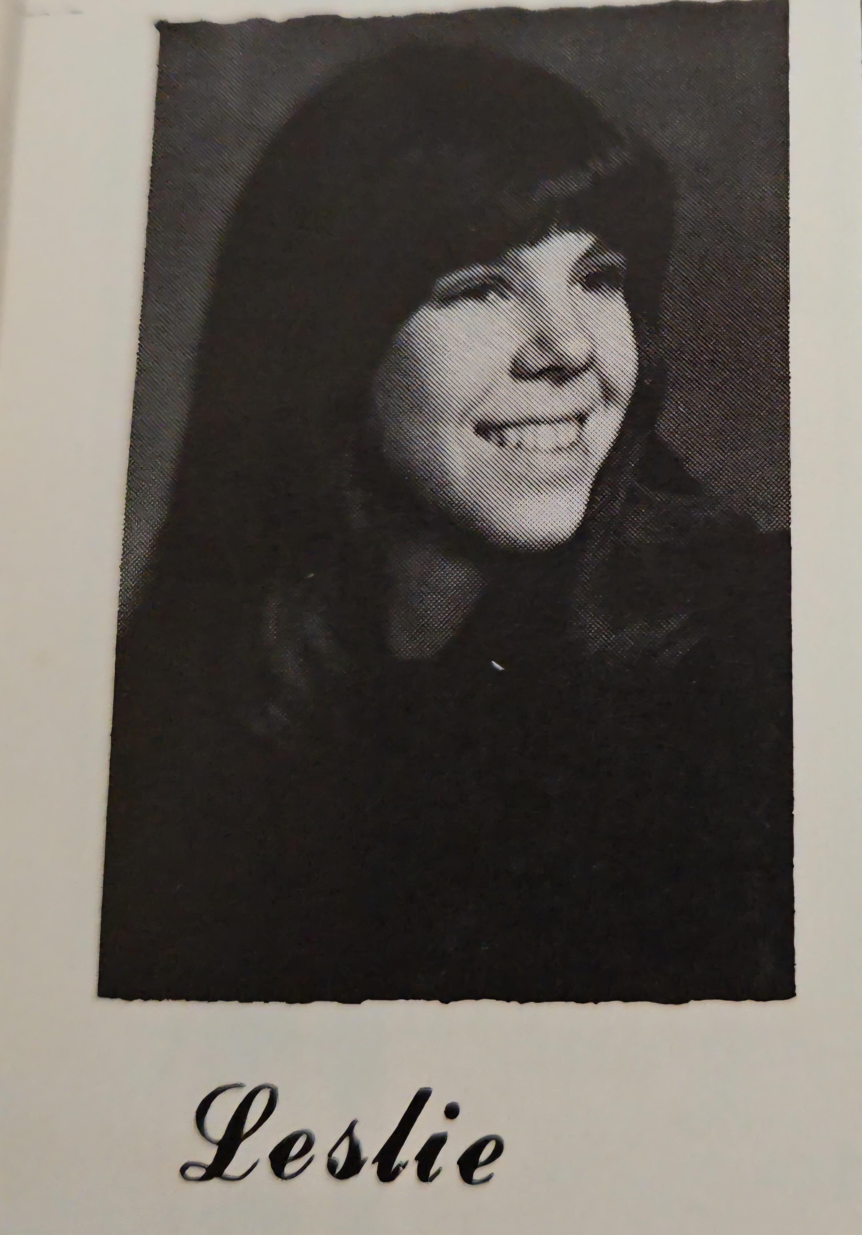 A black and white photo of a woman smiling