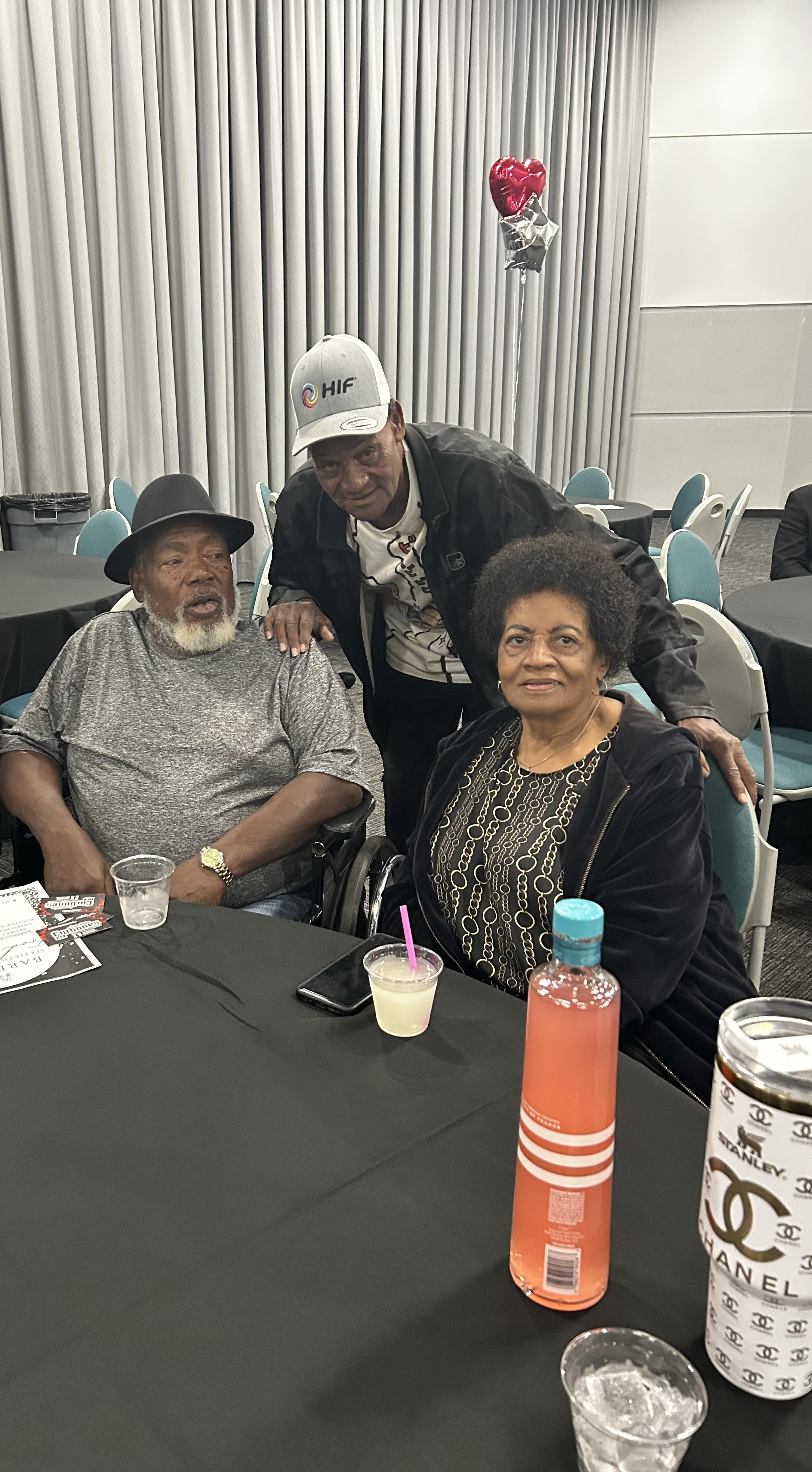 A group of people sitting at a table