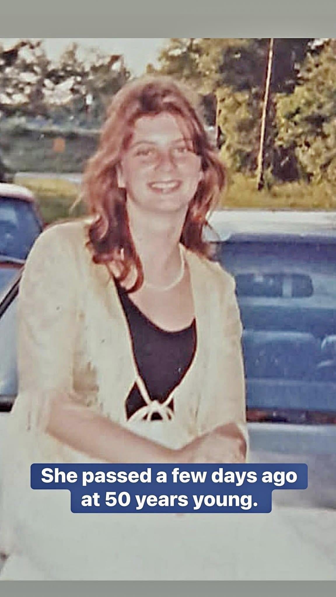 A woman smiling at the camera