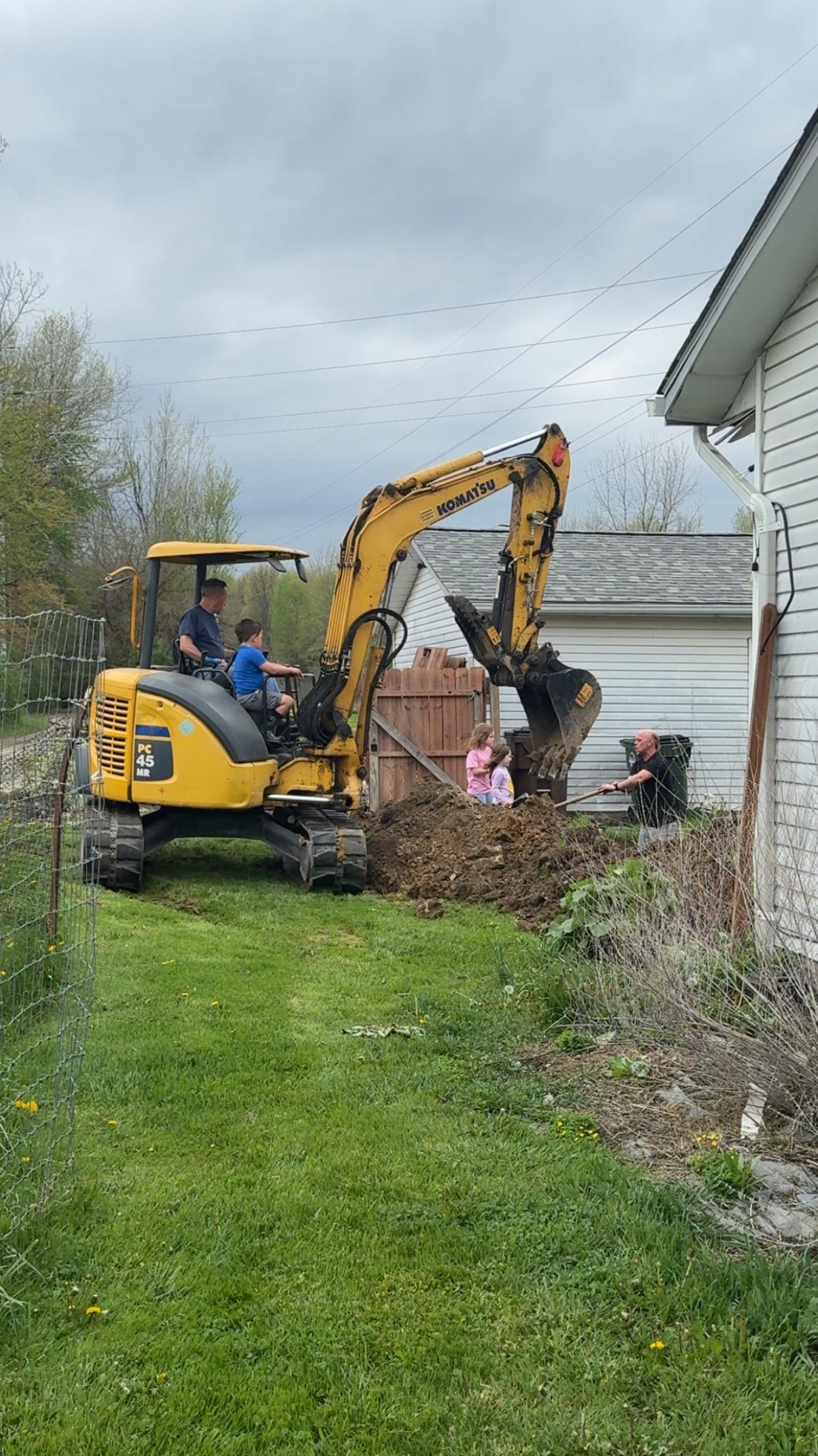 A group of people in a construction vehicle