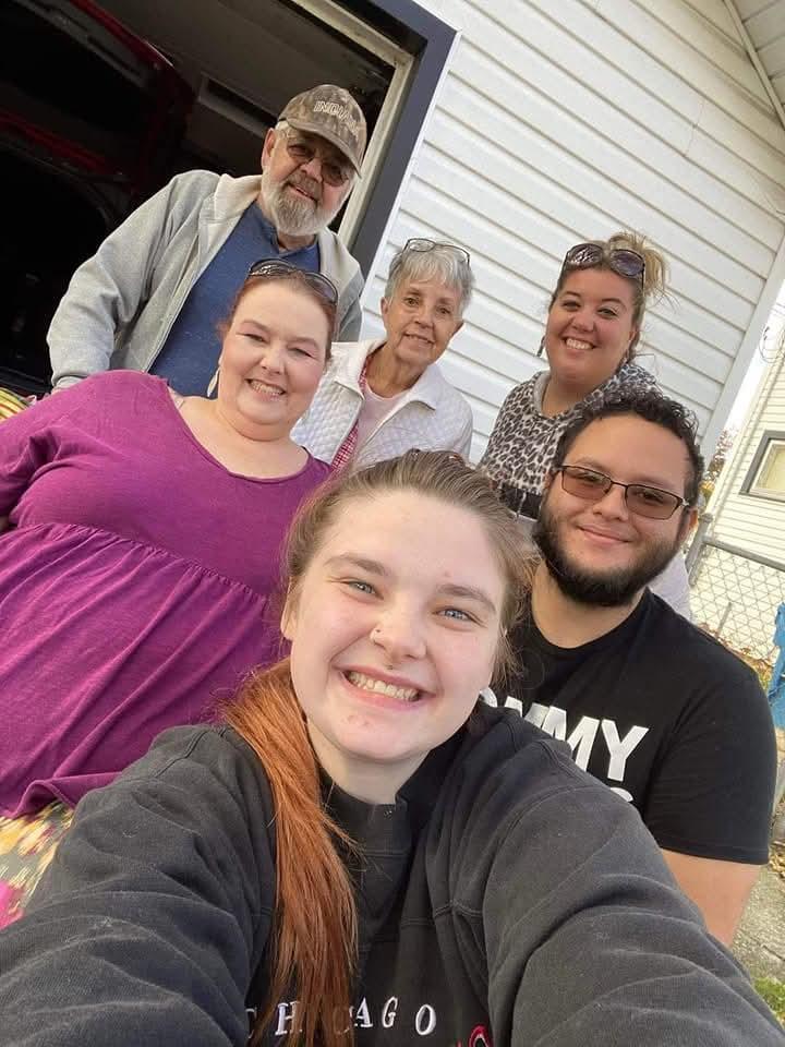 A group of people posing for a selfie