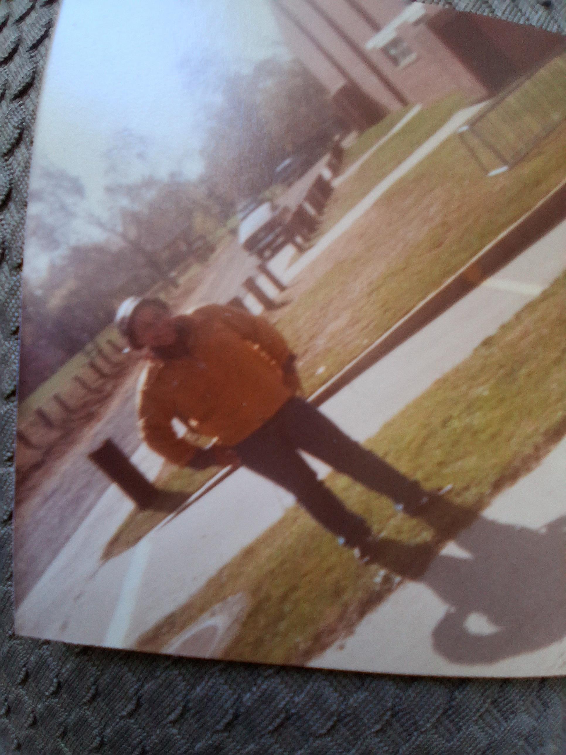 A man standing on a sidewalk