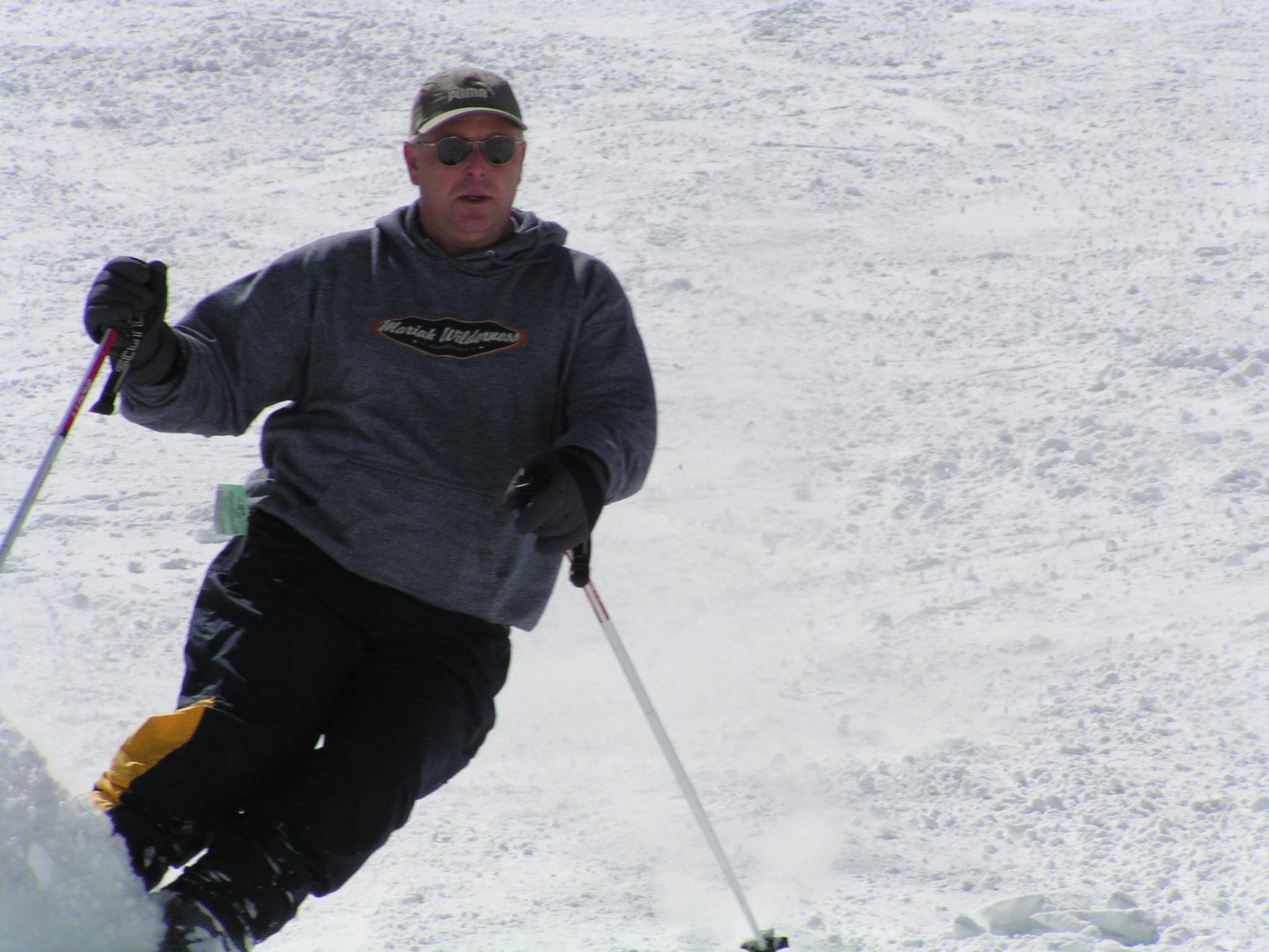 A man skiing down a slope
