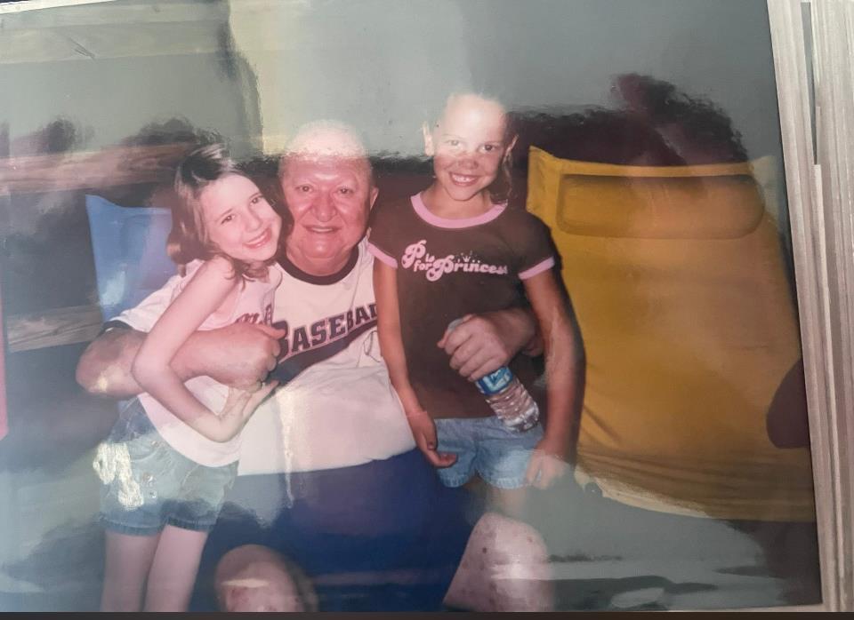 A man and two girls posing for a picture