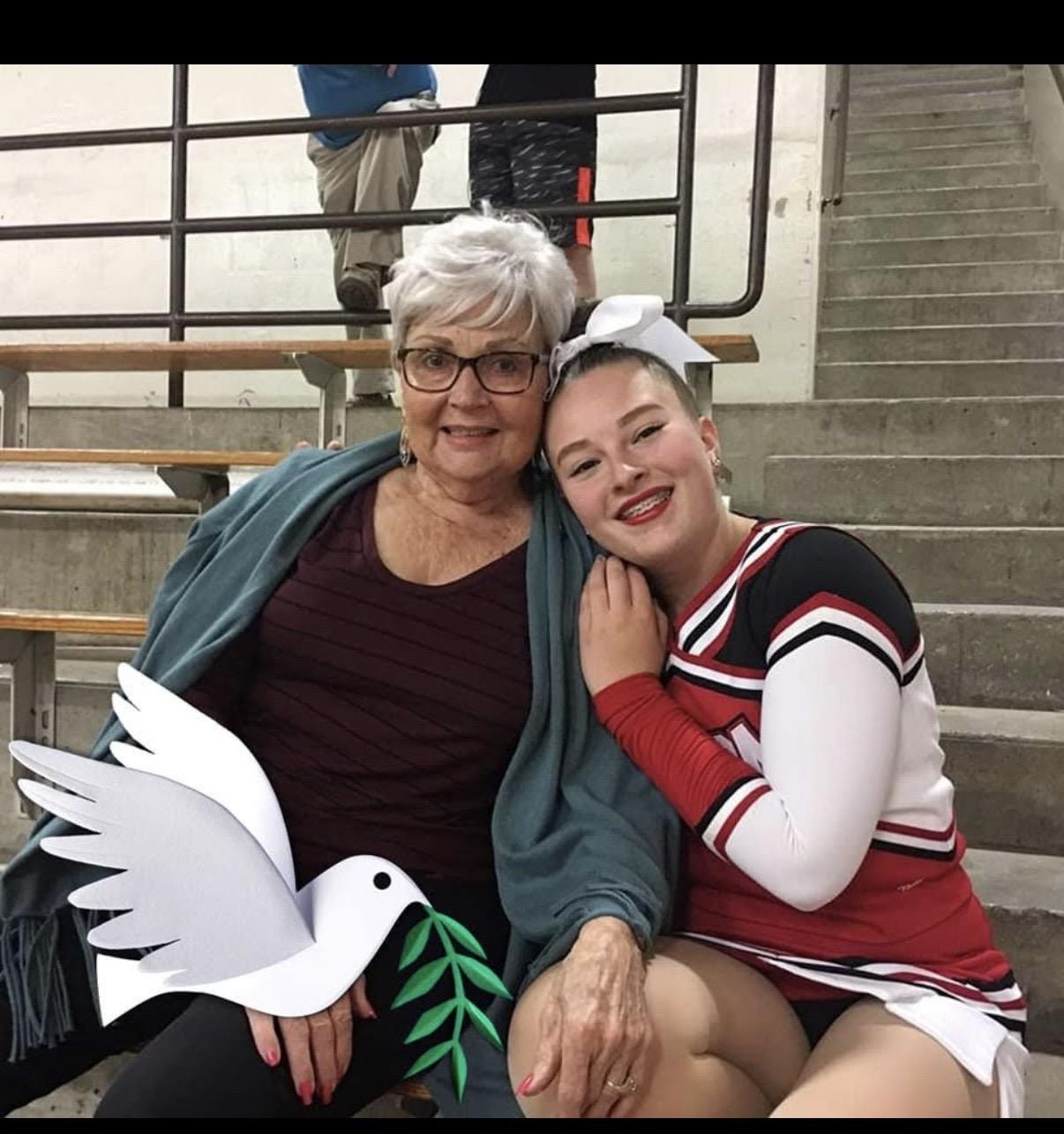 Two women sitting on stairs