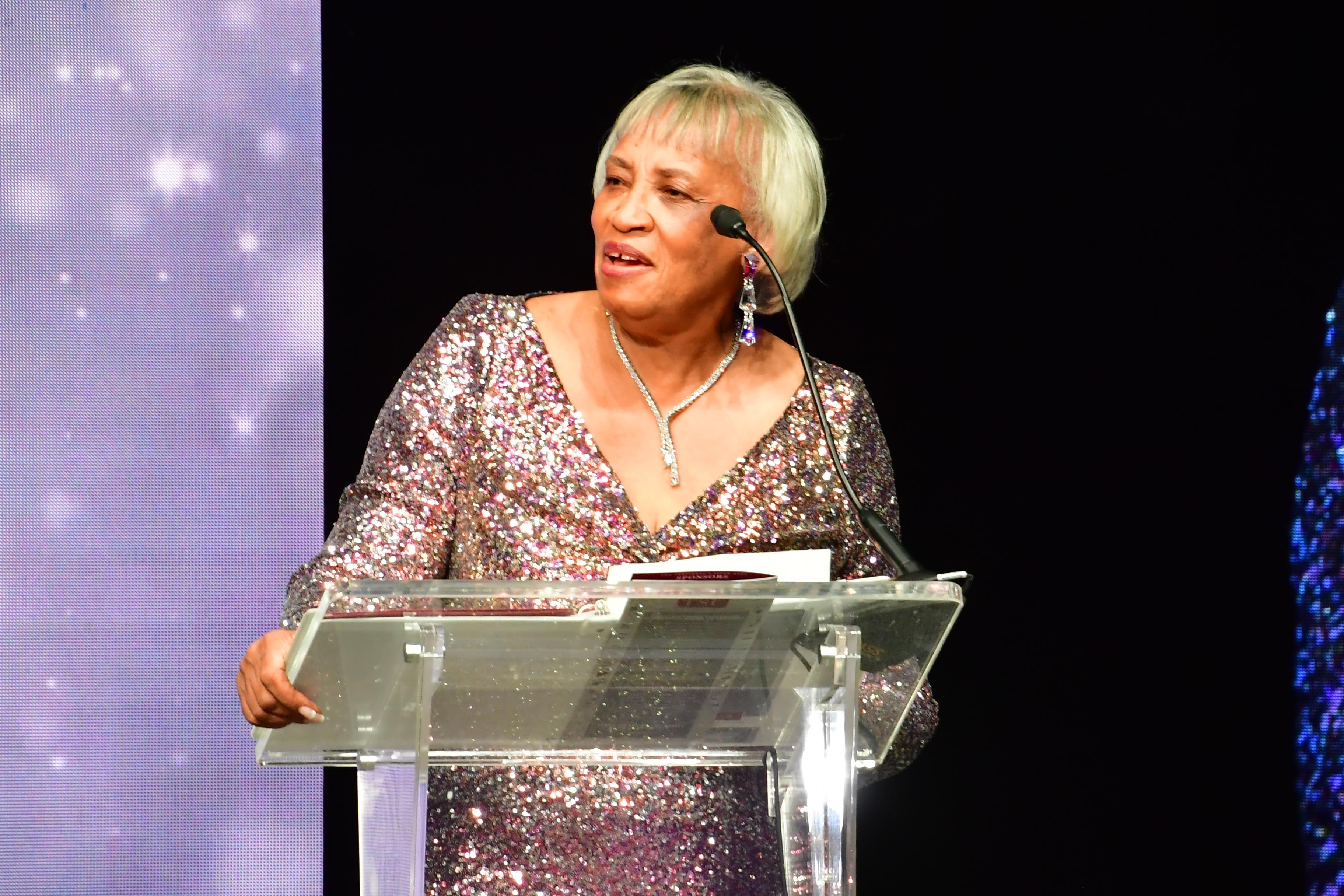 A woman standing at a podium