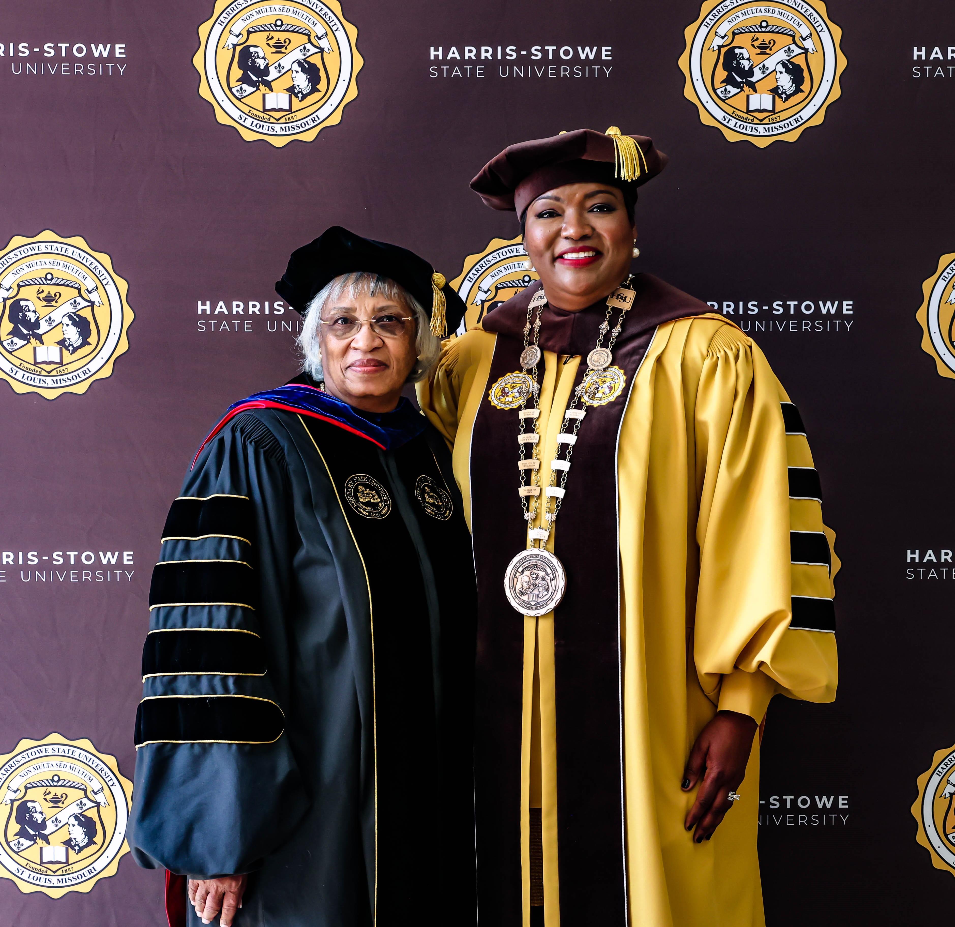 Two women in graduation gowns