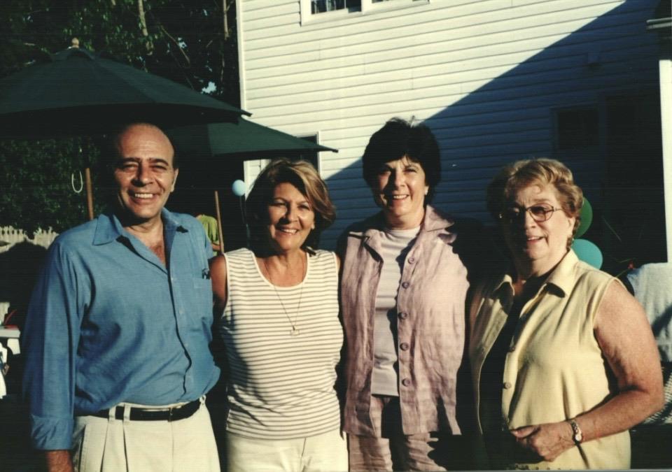 A group of people standing together outside