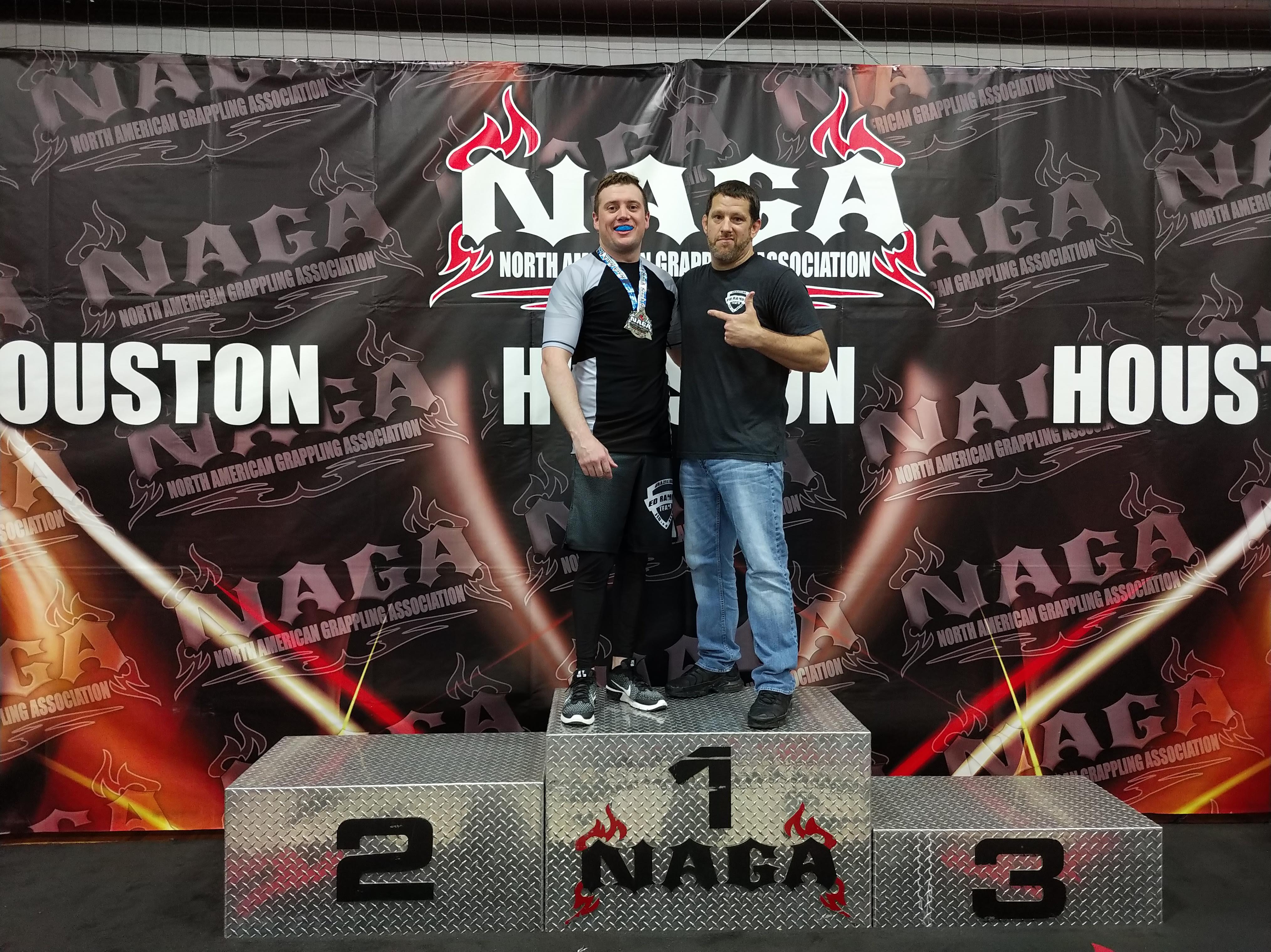 Two men standing on a podium
