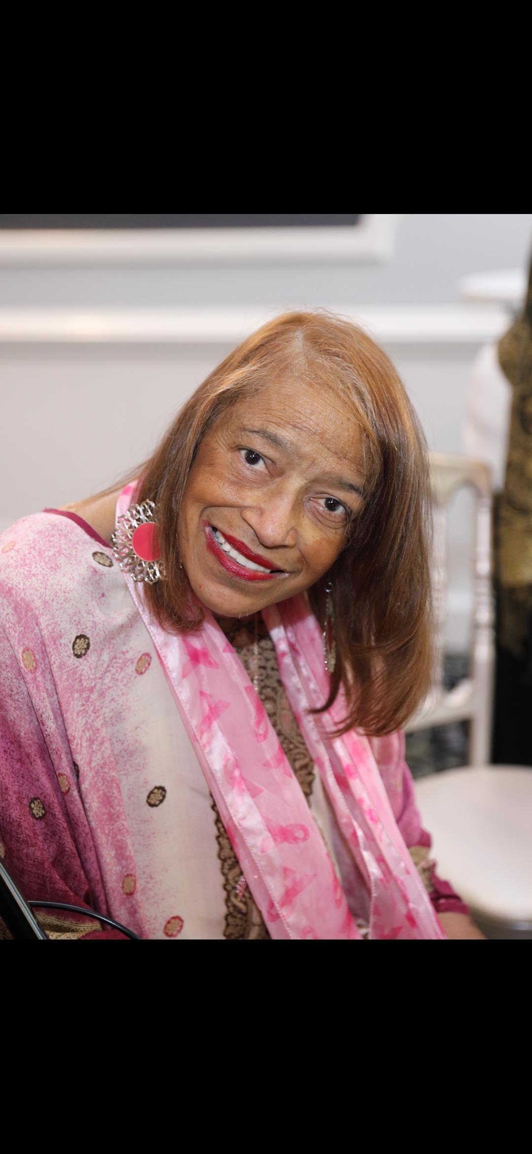 A woman smiling at the camera