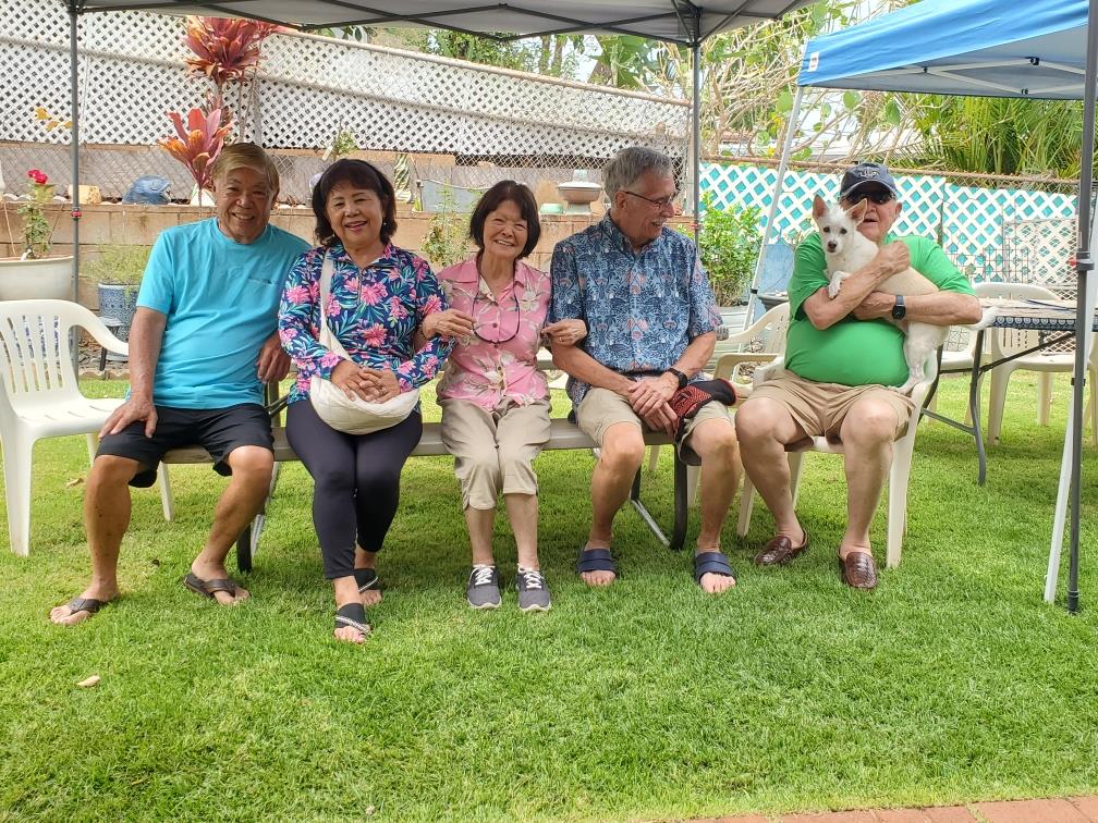A group of people sitting on a bench