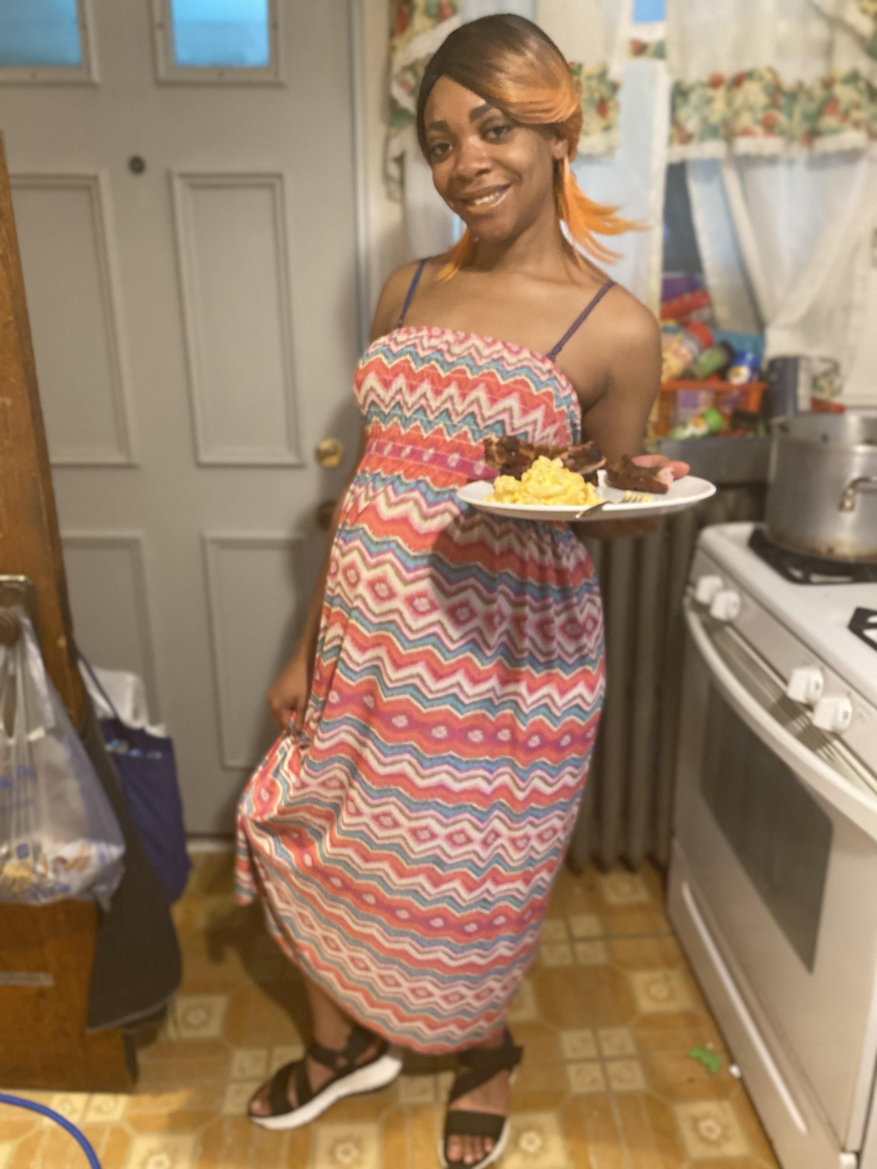A woman holding a plate of food