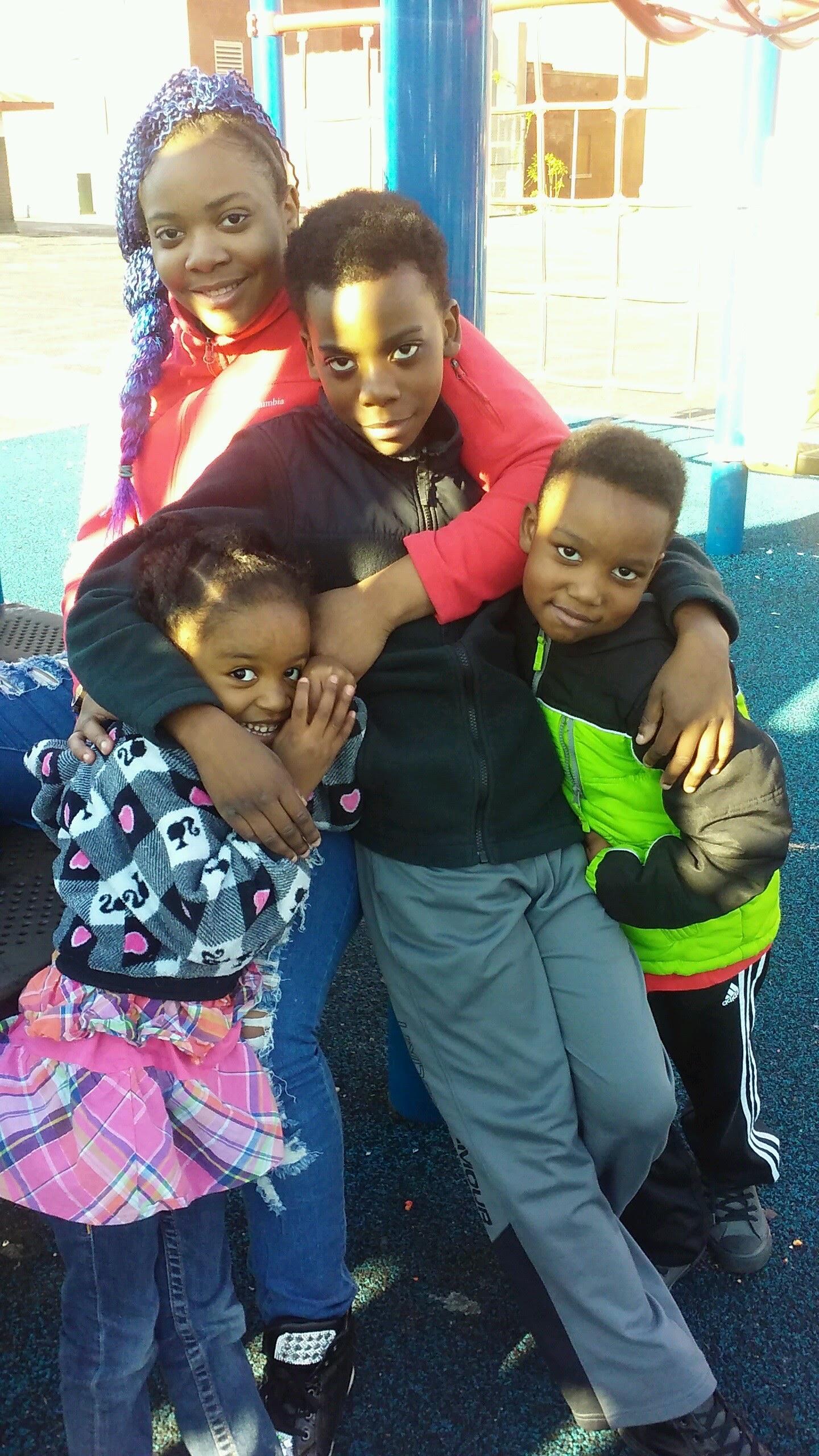 A group of kids posing for a picture
