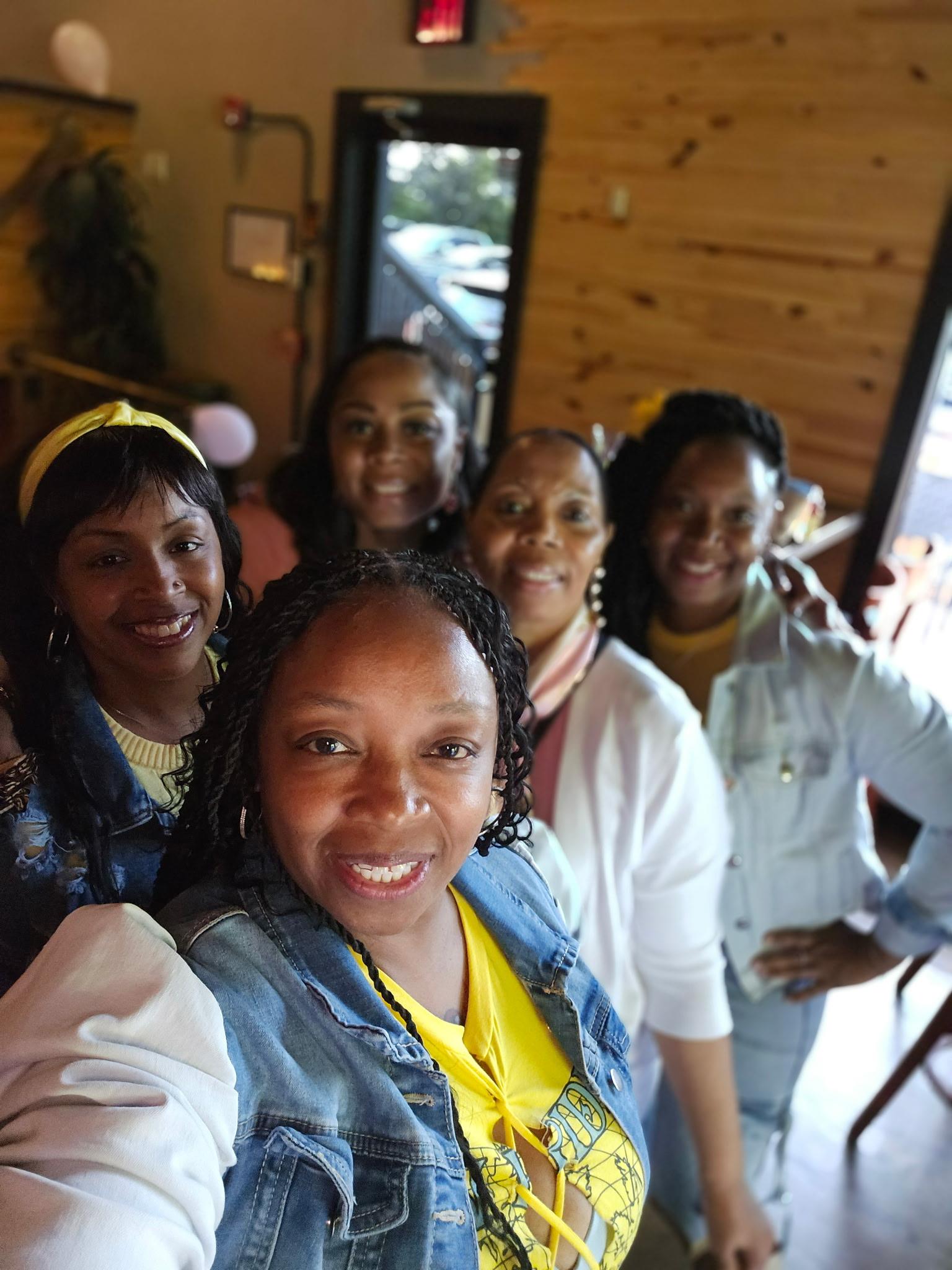 A group of women smiling for a selfie