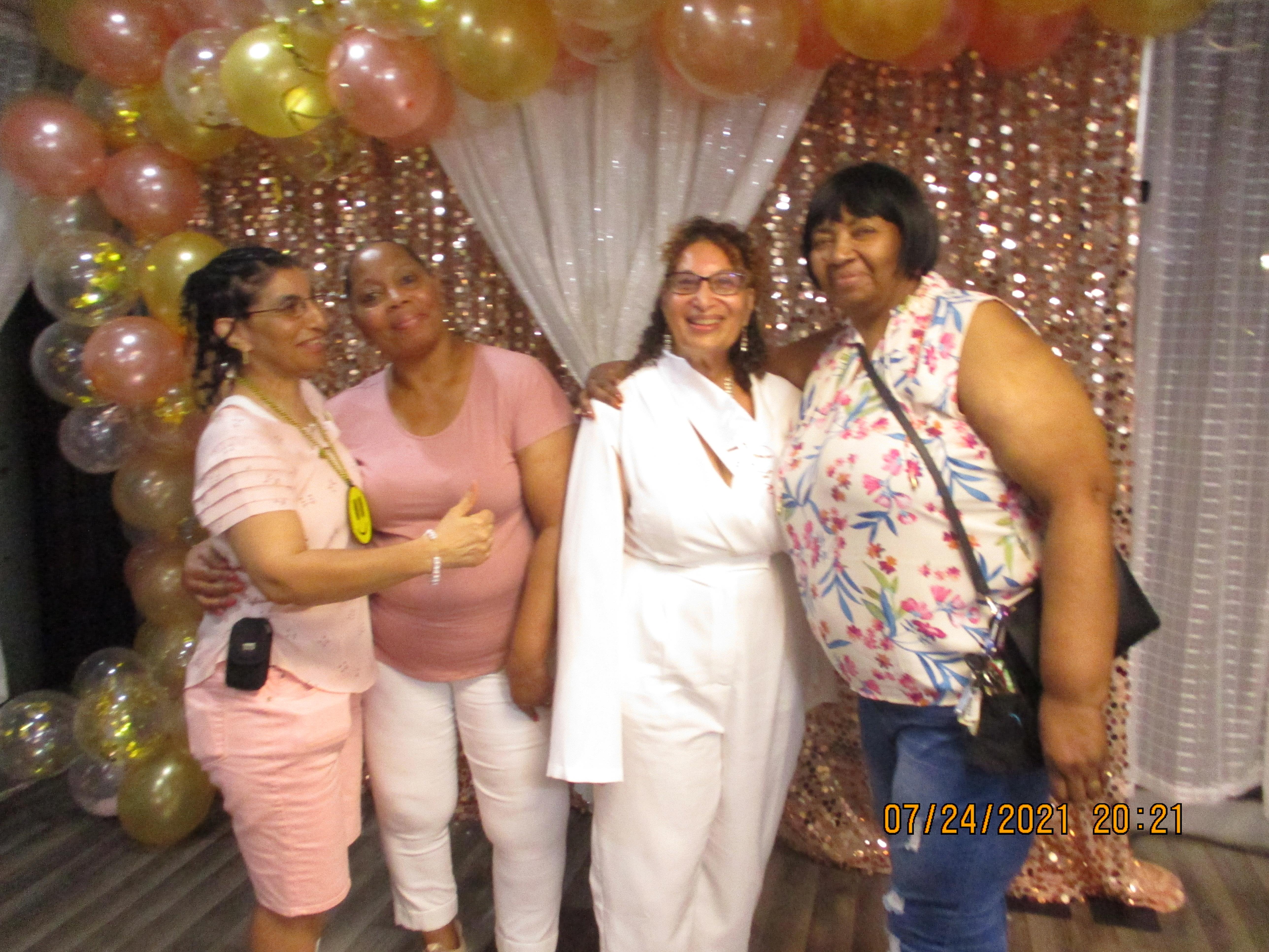 A group of women posing for a photo