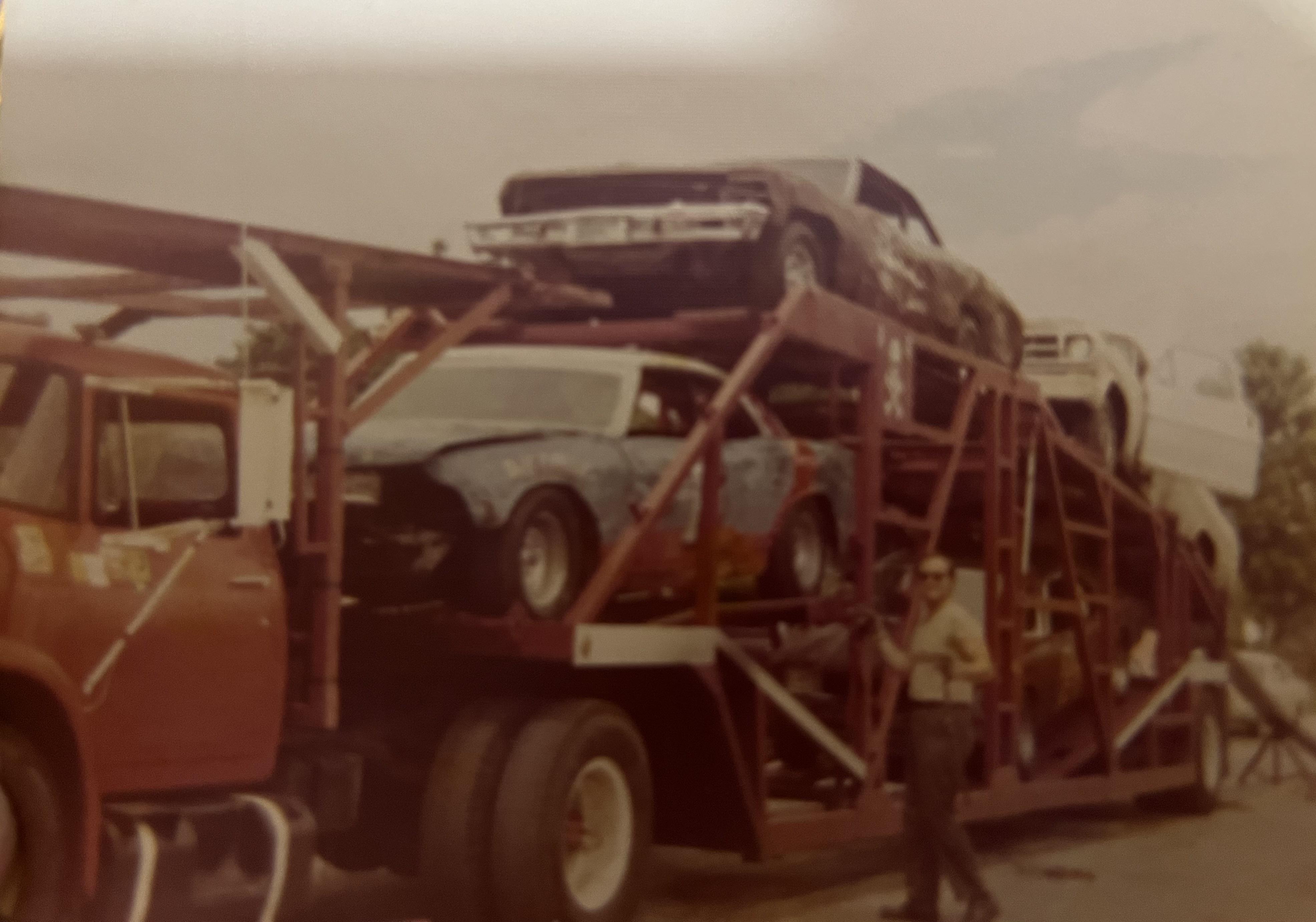 A truck carrying cars