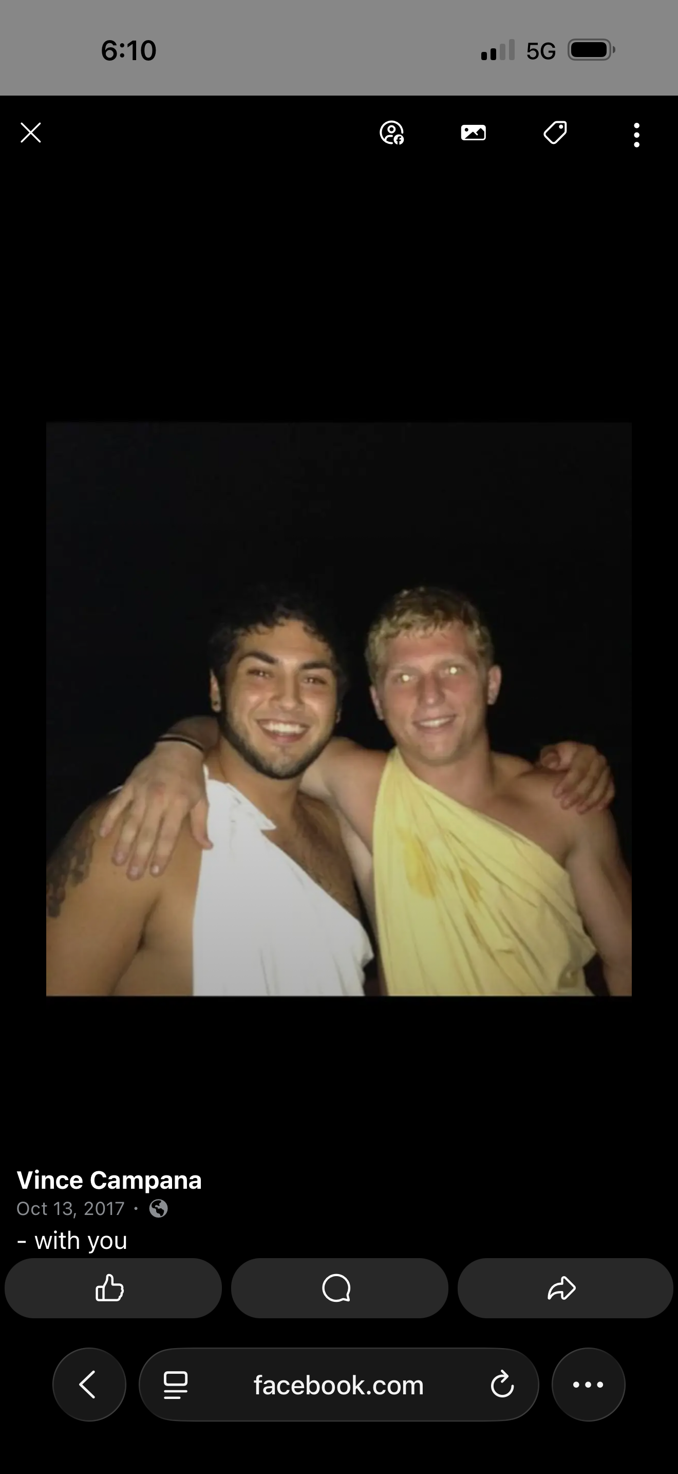 Two men wearing clothing posing for a photo
