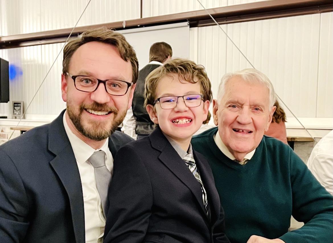 A group of men smiling for a picture