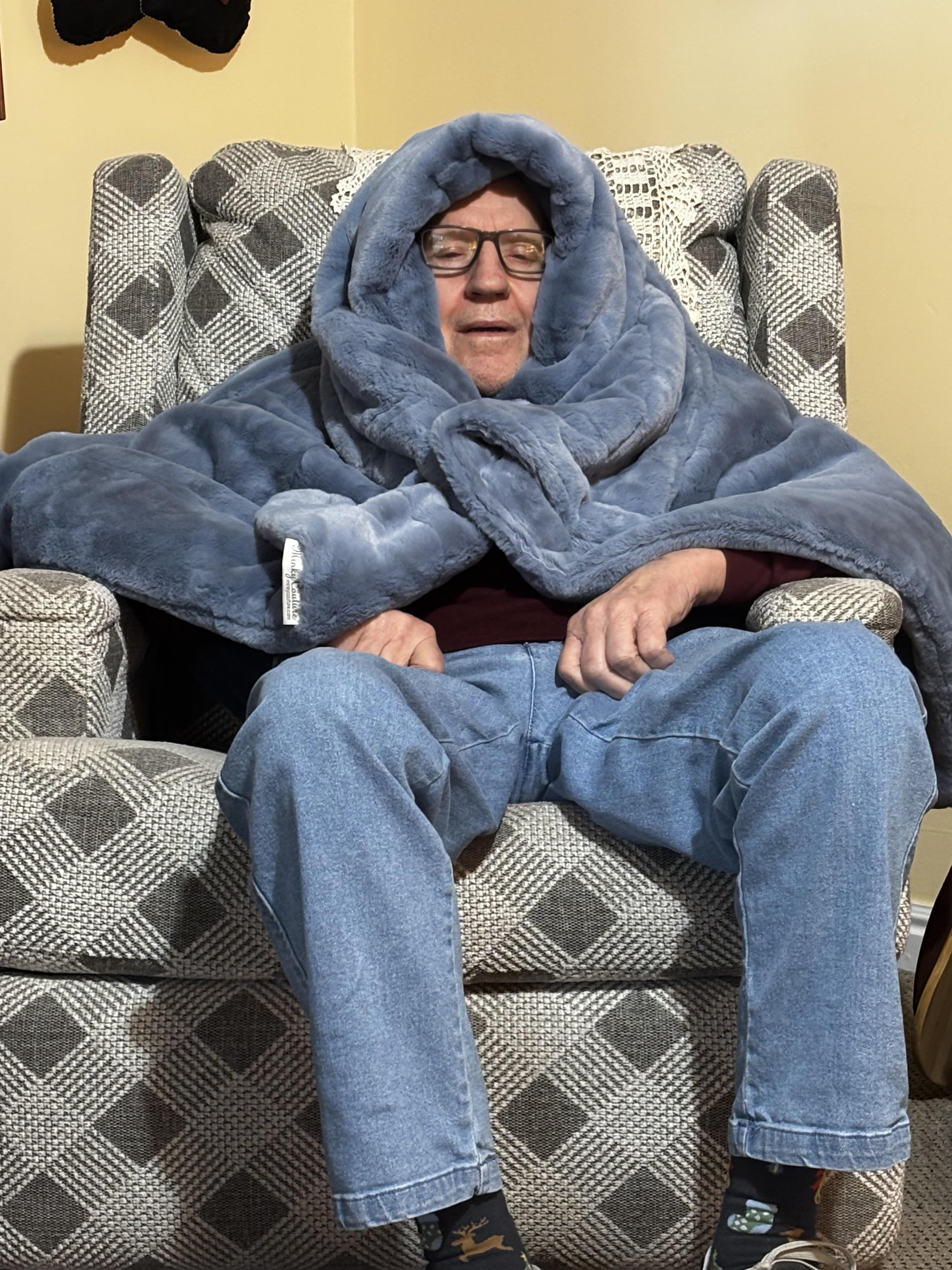 A man wrapped in a blanket