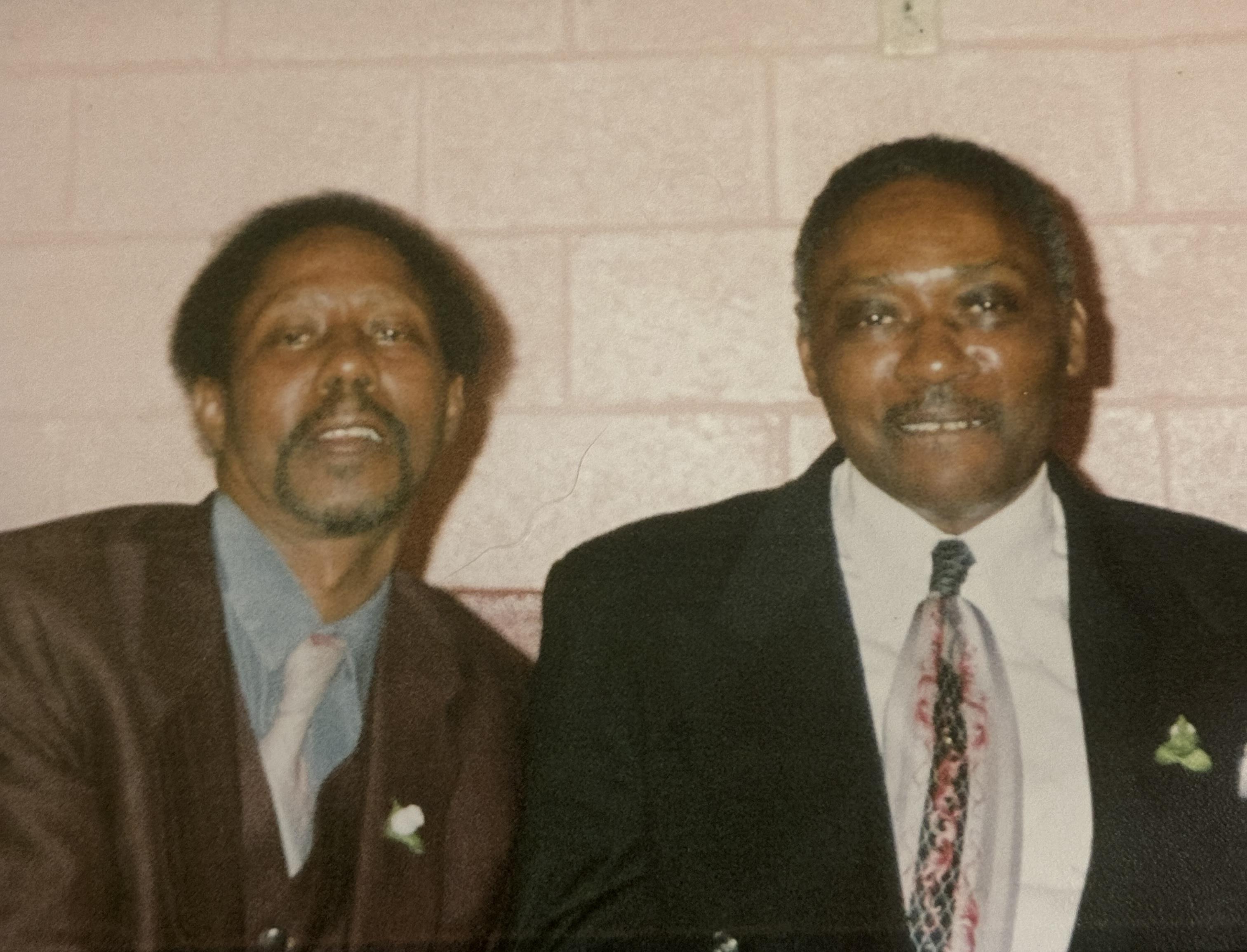 A couple of men in suits