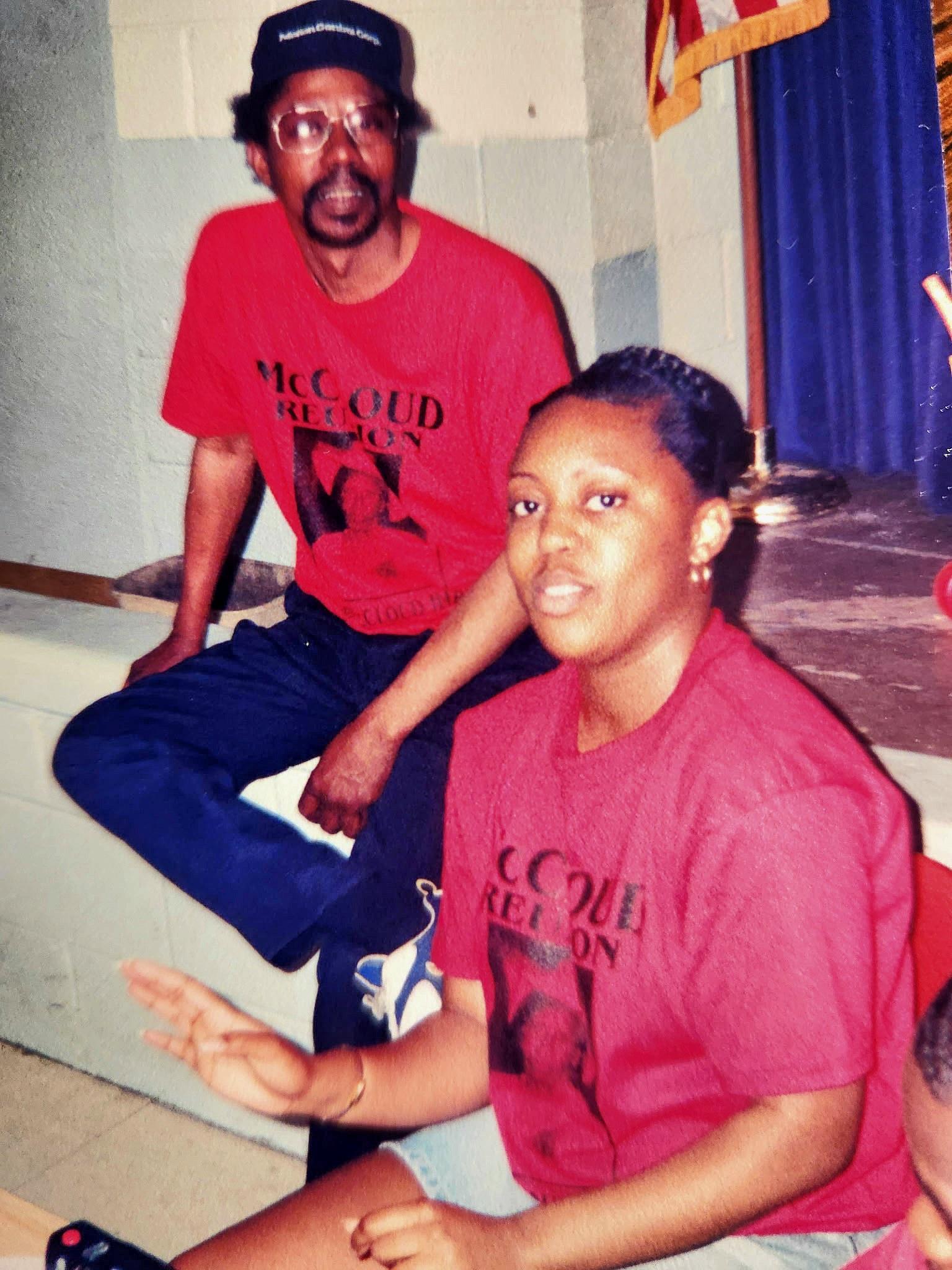 A man and woman in red shirts