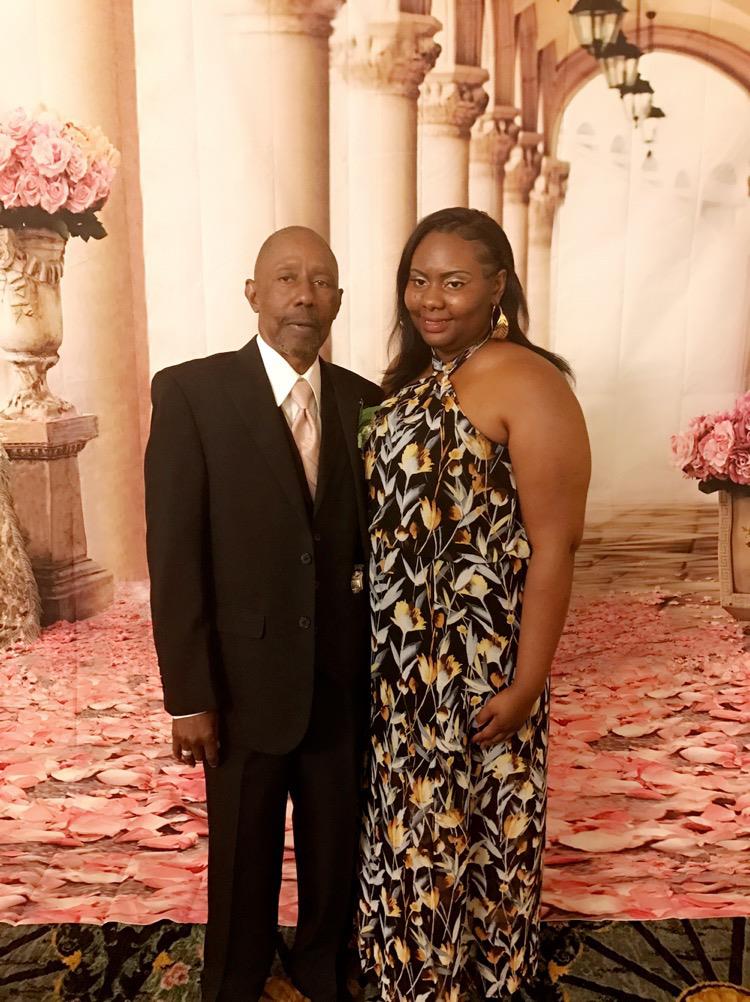 A man and woman posing for a picture