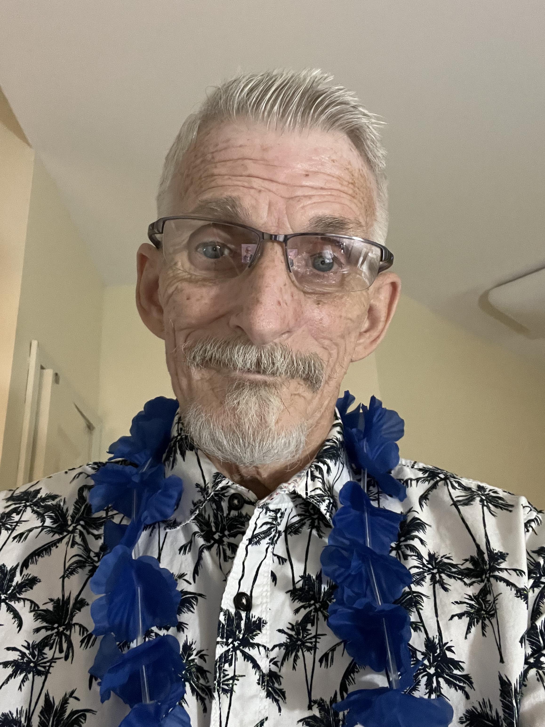 A man wearing a hawaiian shirt