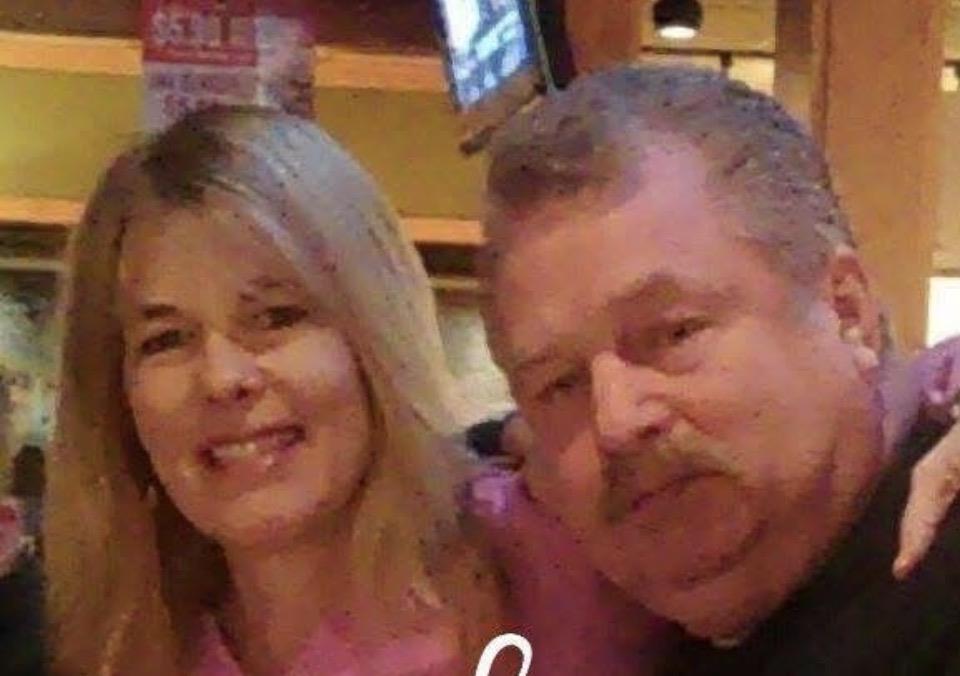 A man and woman smiling for a picture