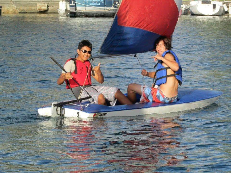 Two men on a small boat