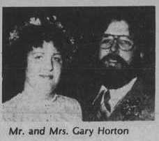 A man and woman posing for a picture