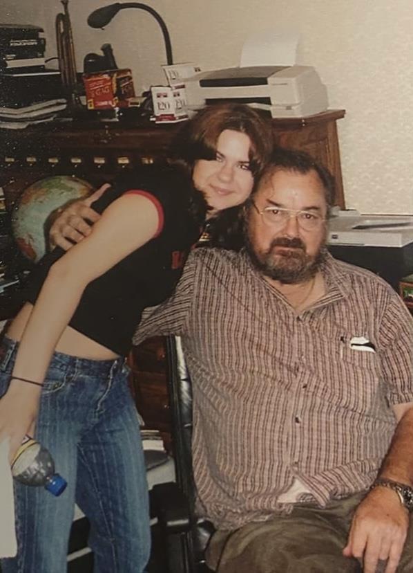 A man and woman posing for a picture