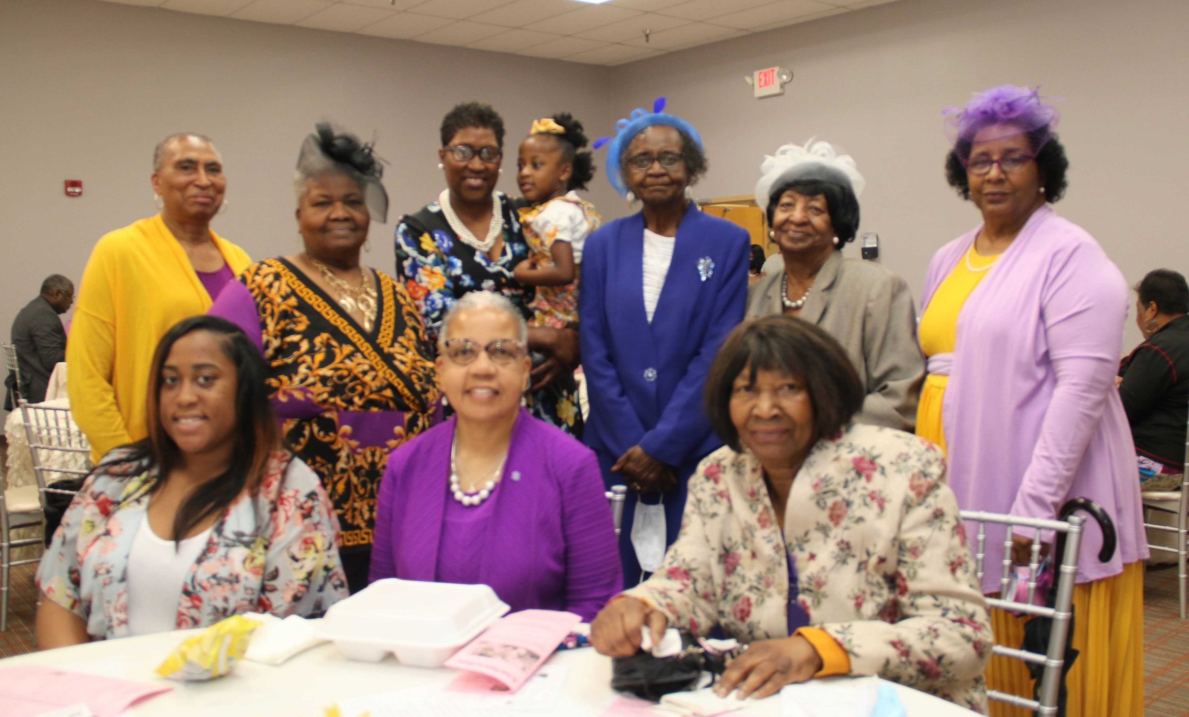 A group of women posing for a photo