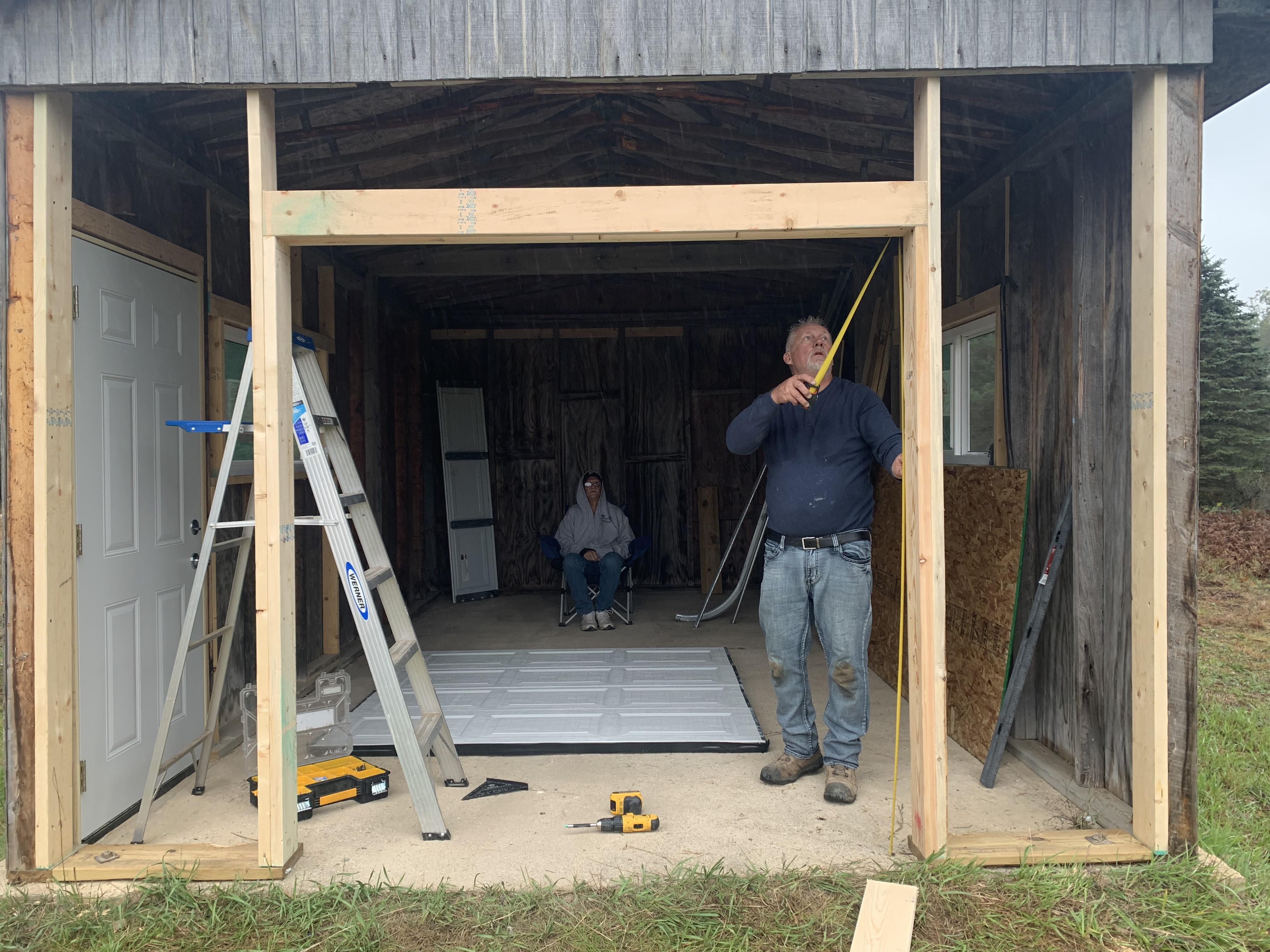 A man standing in a shed