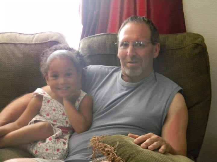 A man and a child sitting on a couch