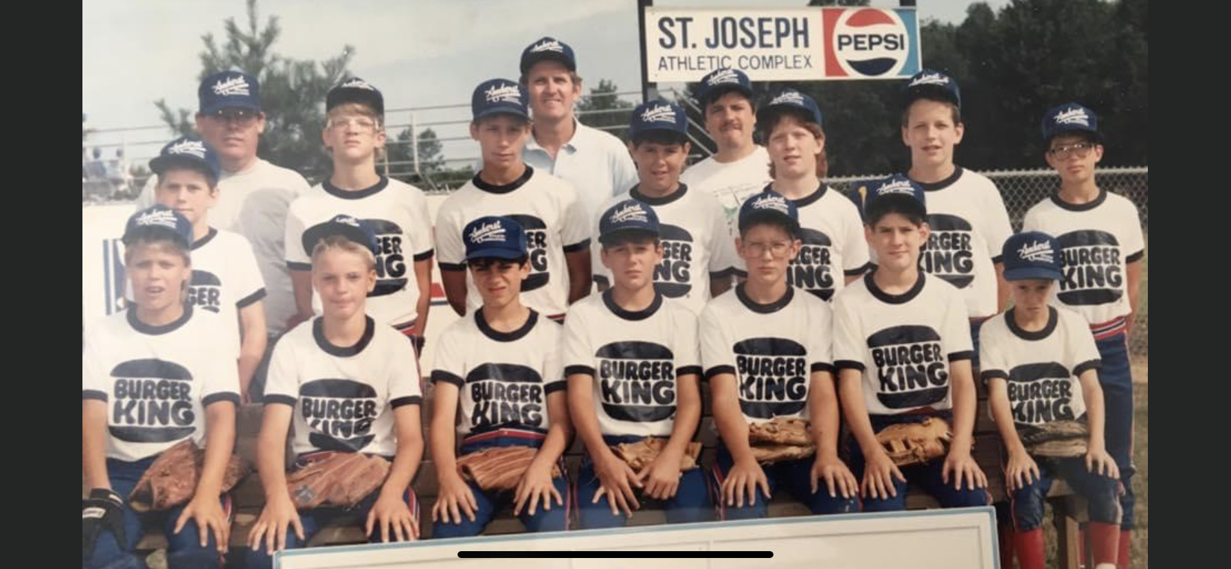 A group of boys in baseball uniforms