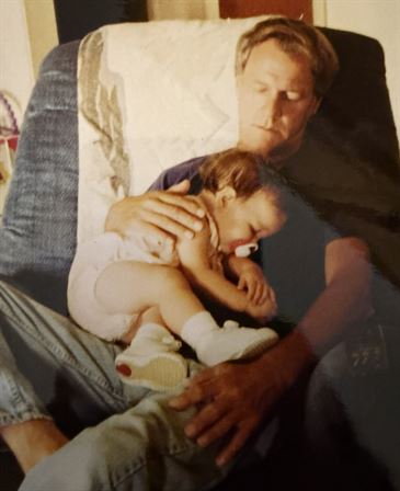 A man holding a baby