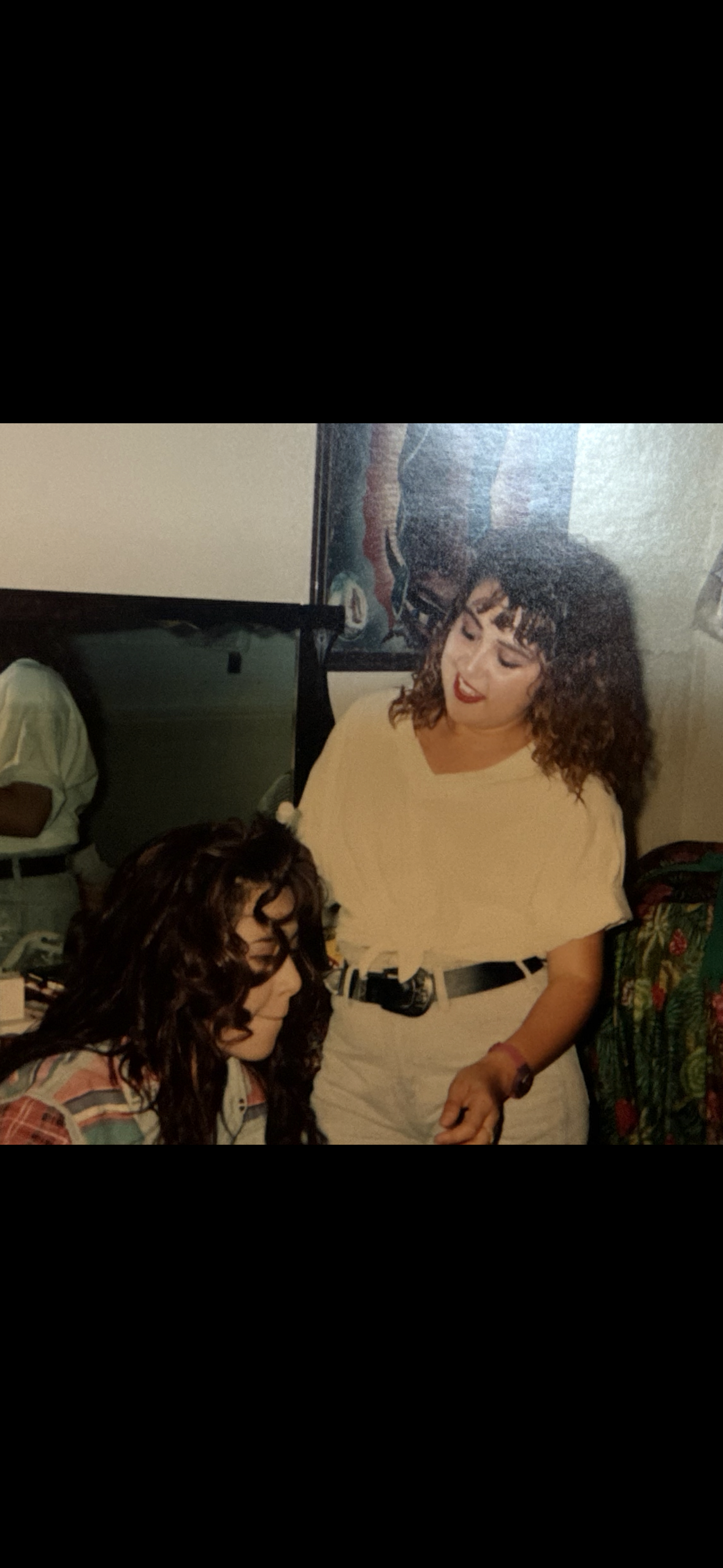 A woman standing next to a woman
