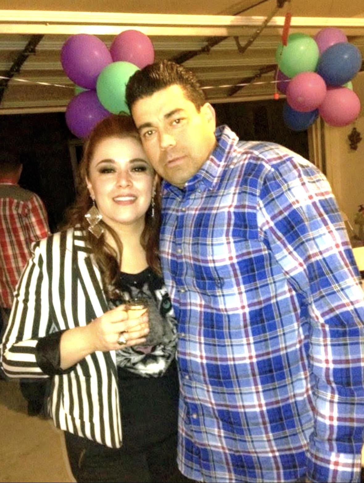 A man and woman posing for a picture