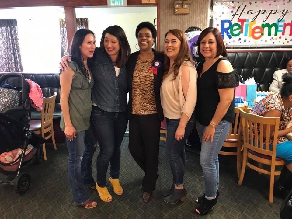 A group of women posing for a photo