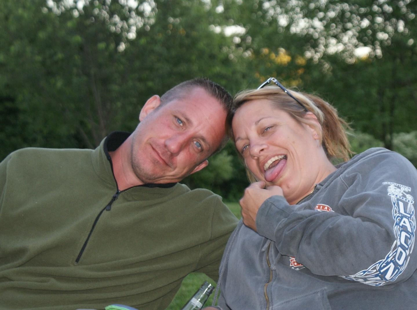 A man and woman posing for a picture
