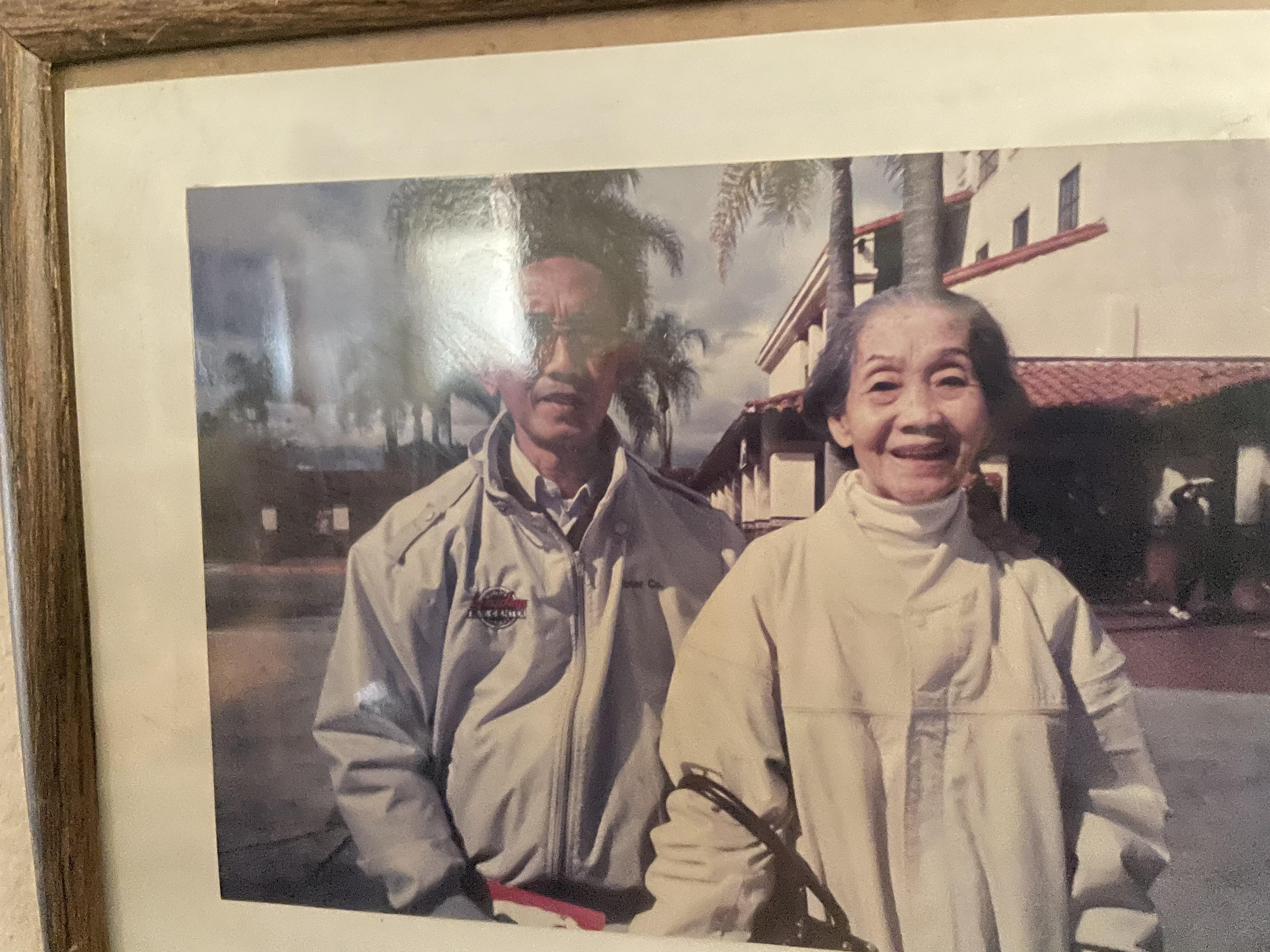A man and woman in a picture frame