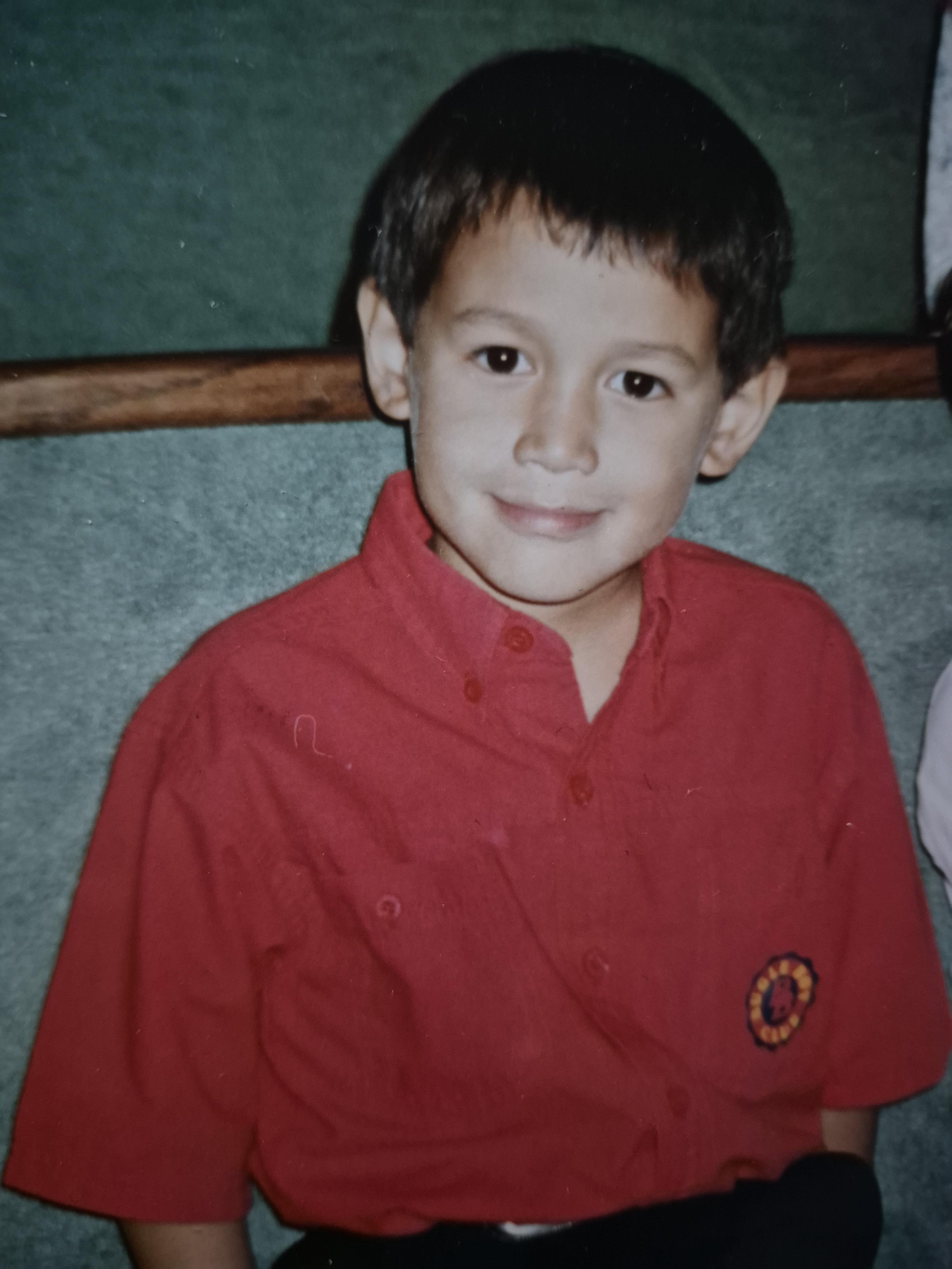 A boy in a red shirt