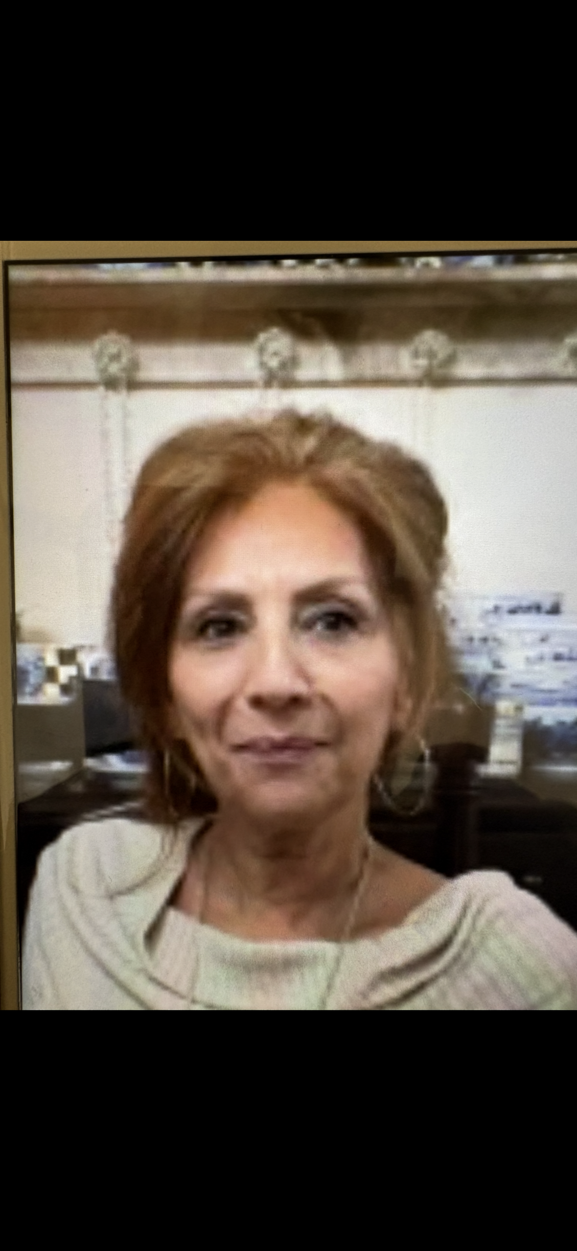 A woman smiling for the camera