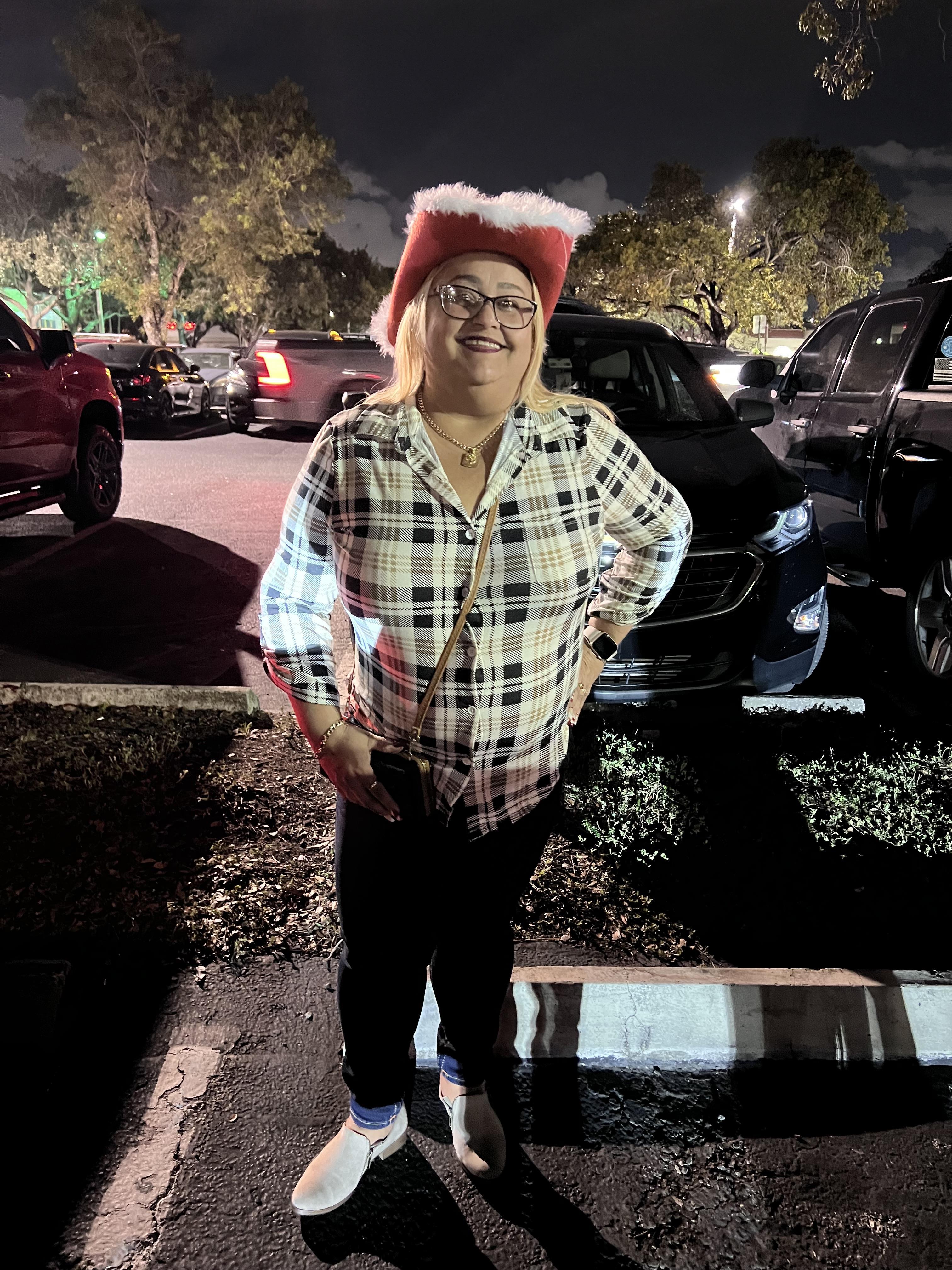 A woman standing in a parking lot