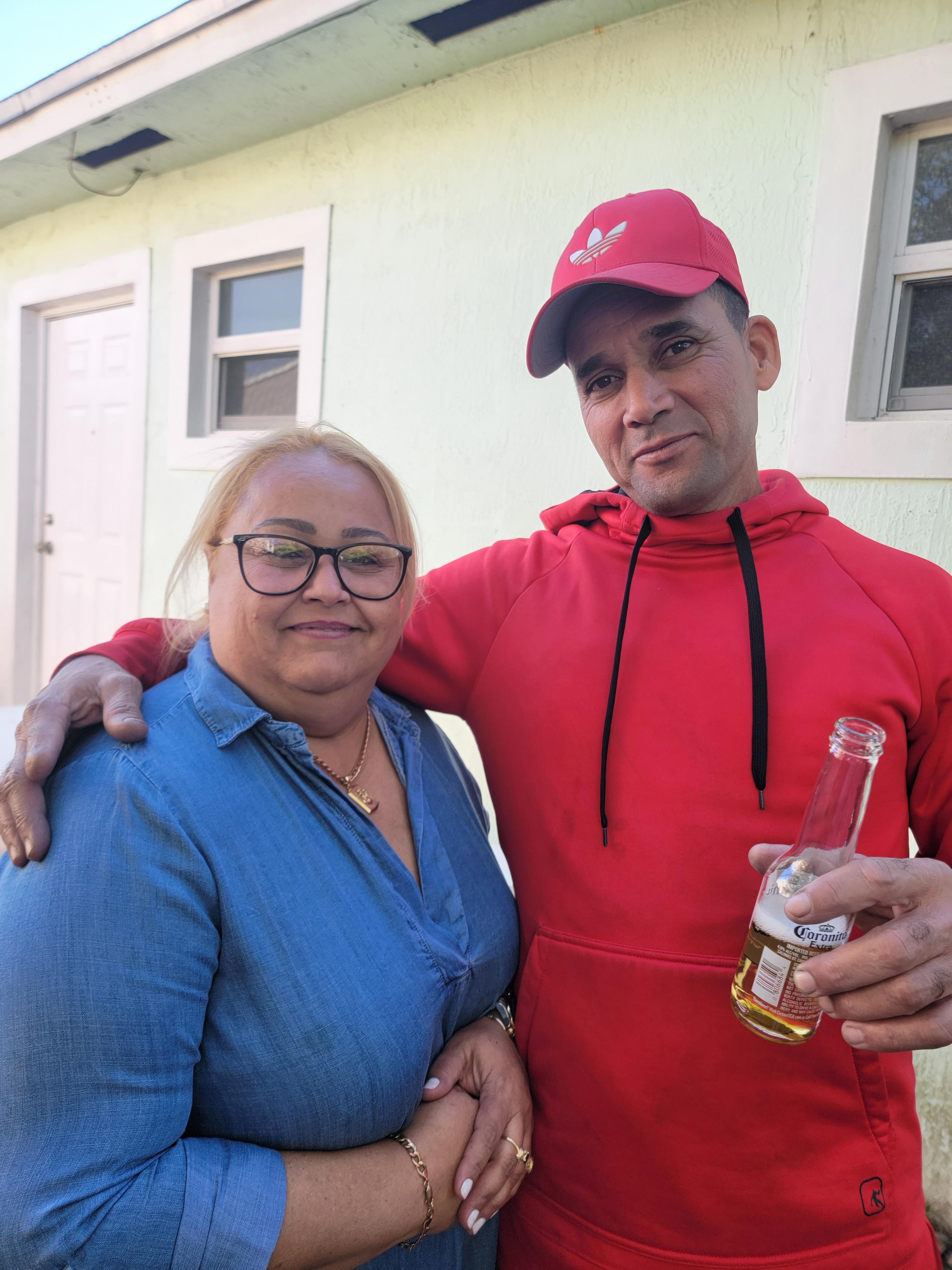 A man and woman posing for a picture