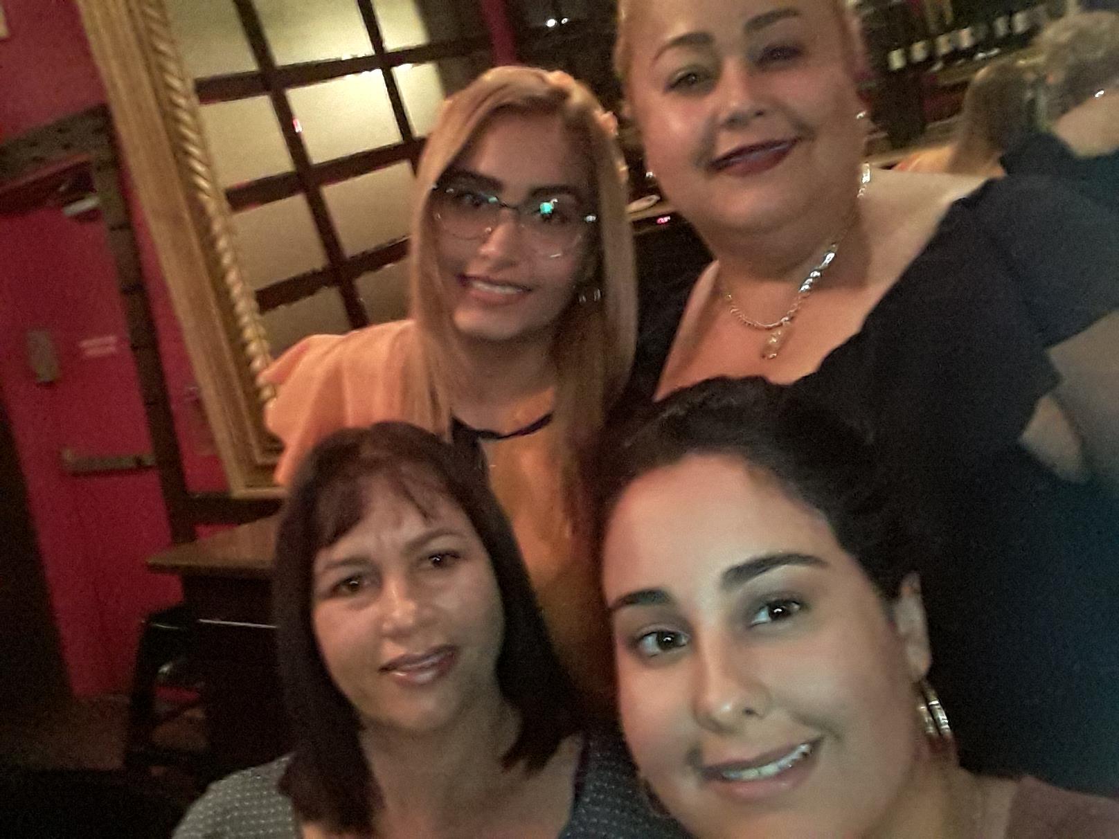 A group of women posing for a photo