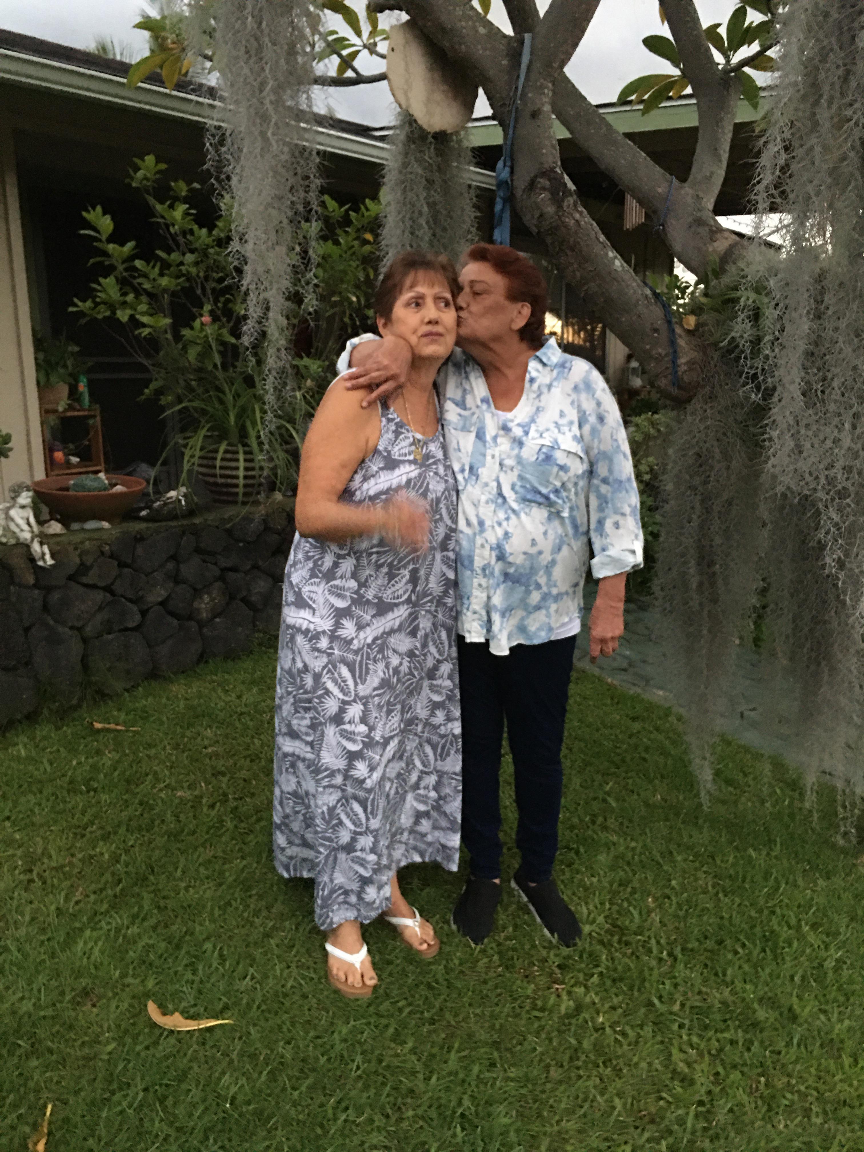 A woman kissing another woman