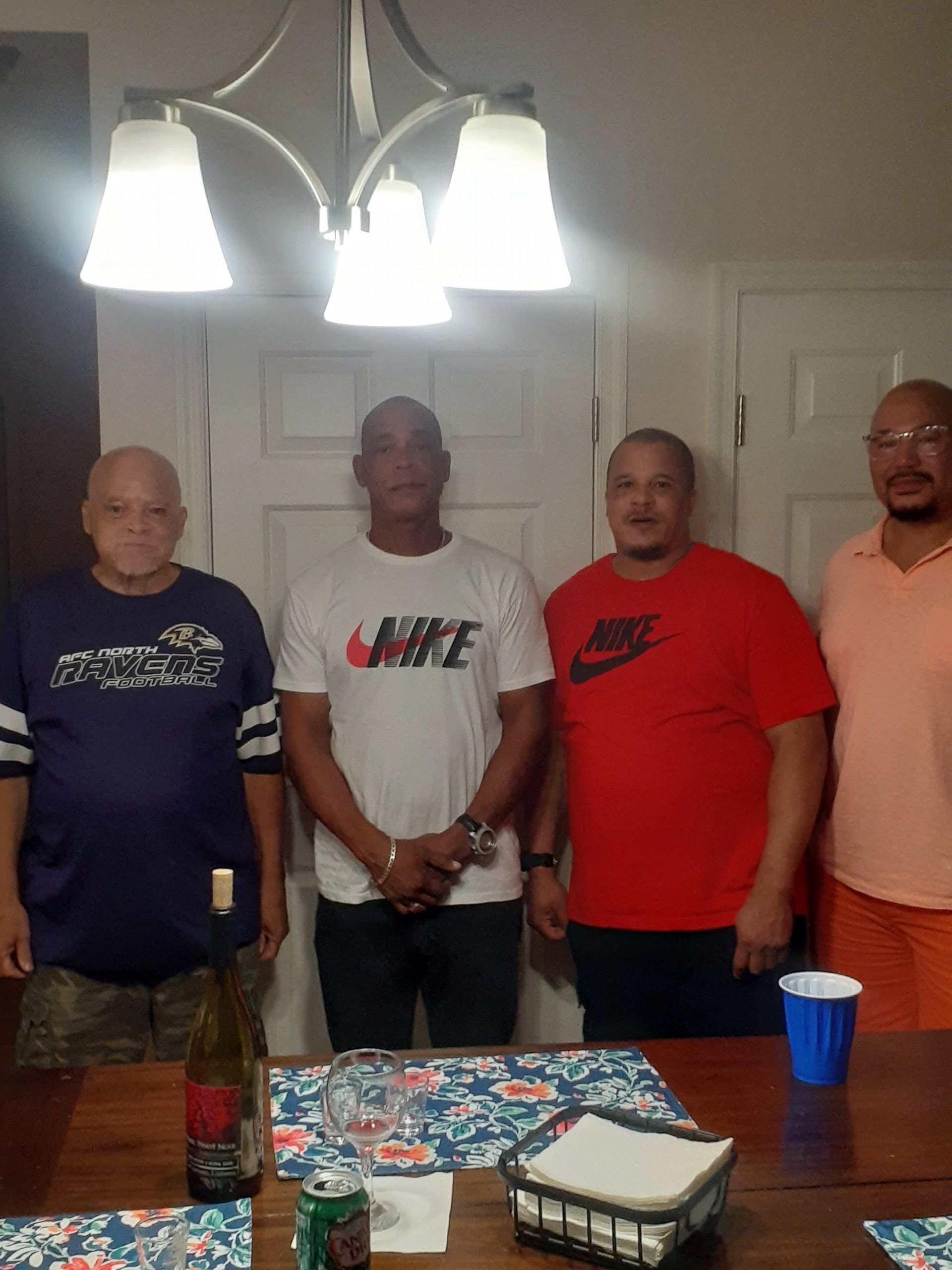 A group of men standing in a room