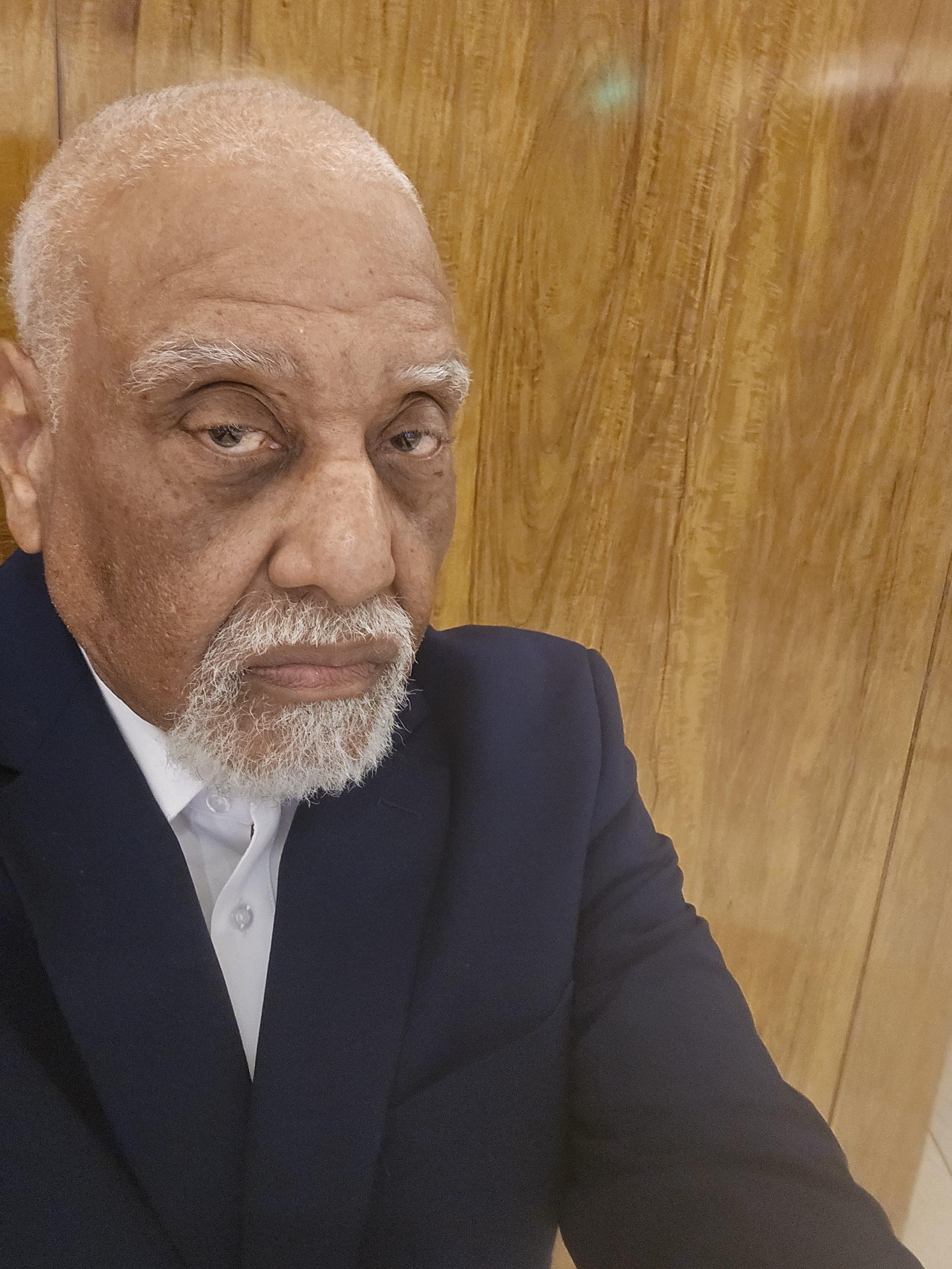 A man with a white beard and mustache