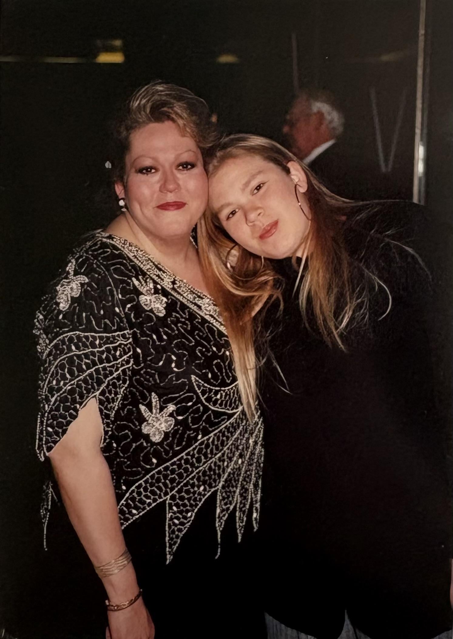 A woman and a young woman posing for a picture